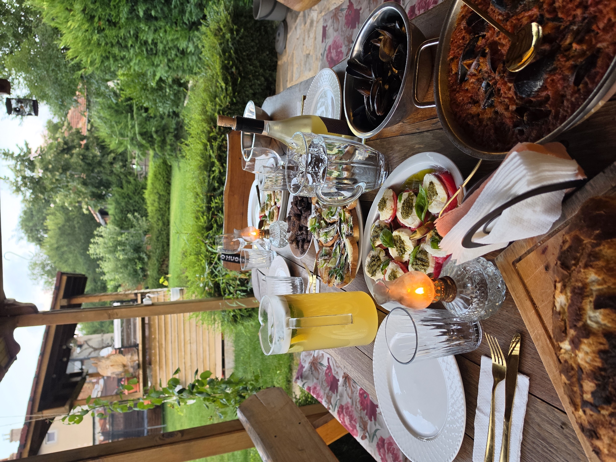 Outdoor dinner at a rustic stone garden property