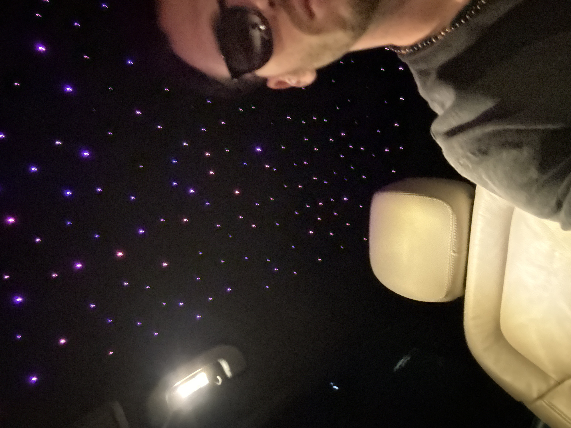 Person spotted in illuminated vehicle interior in Milan