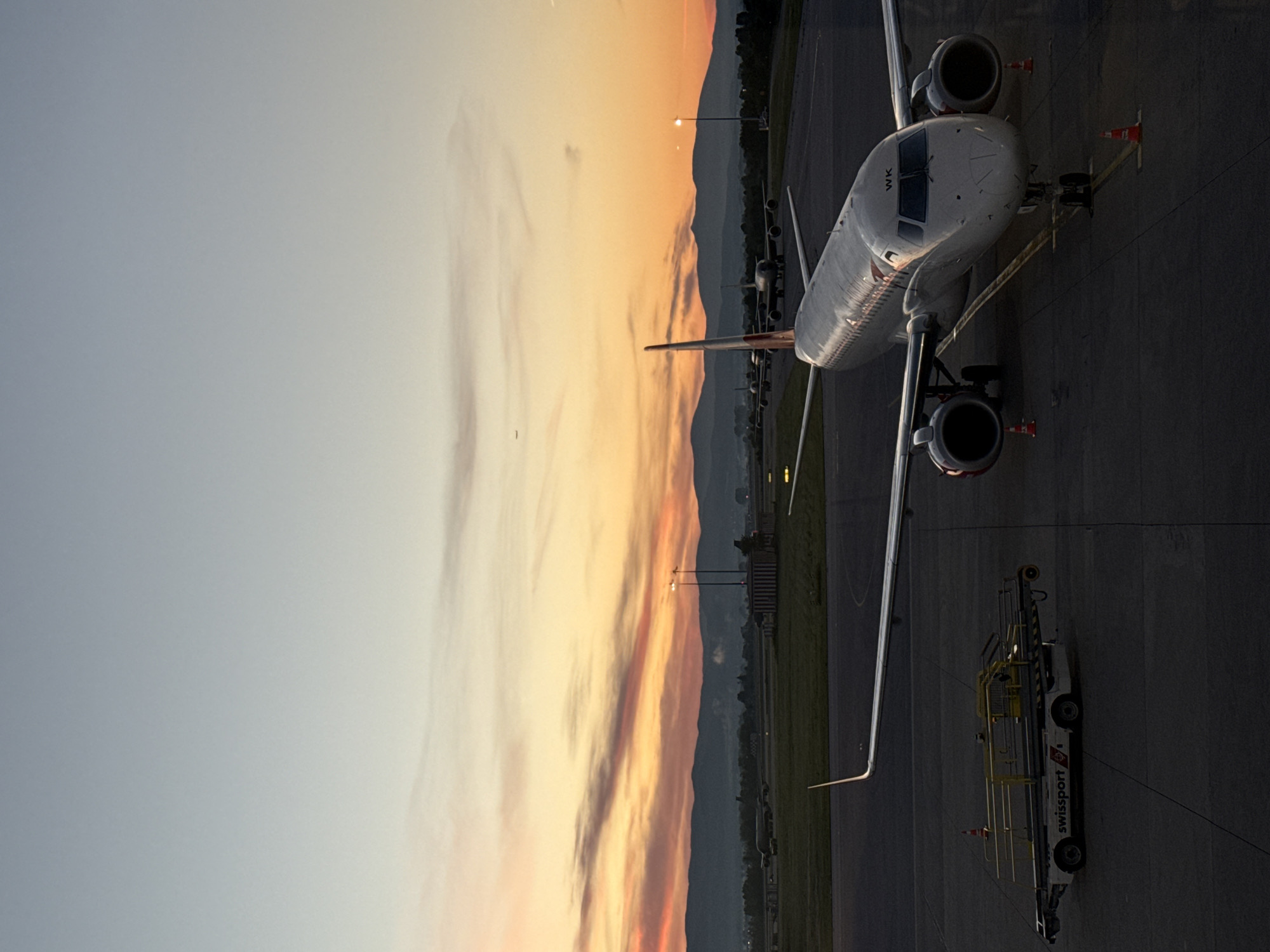 Aircraft parked at Sofia Airport during dusk operations