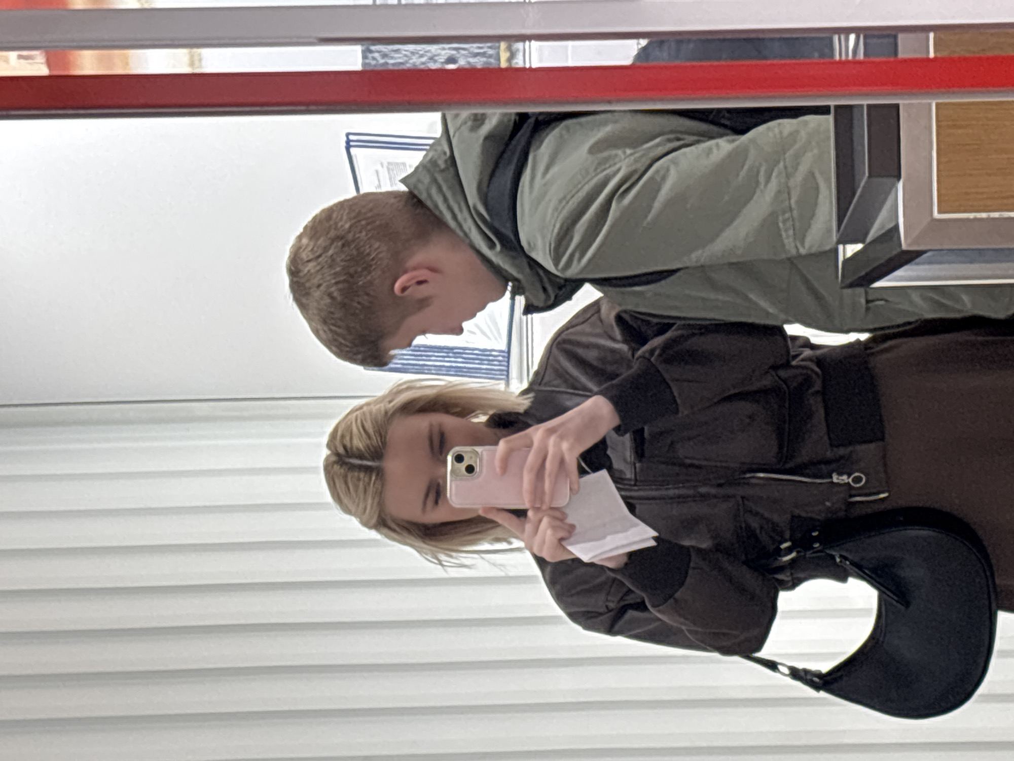 Woman photographs document using smartphone mirror reflection in Russia