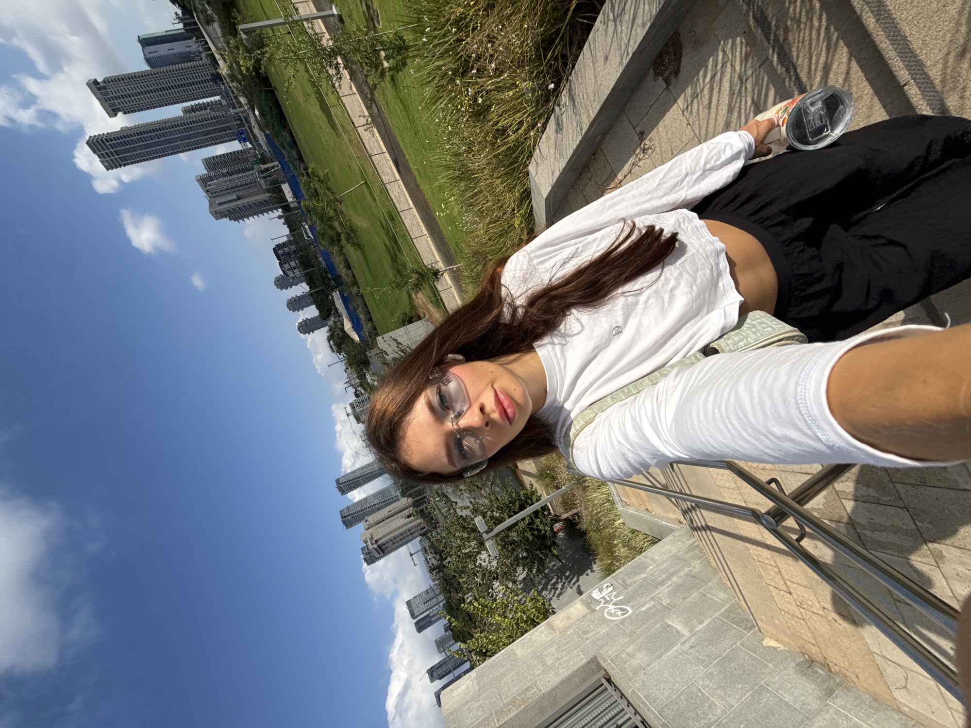 Sunny selfie in a Tel Aviv park with skyline backdrop