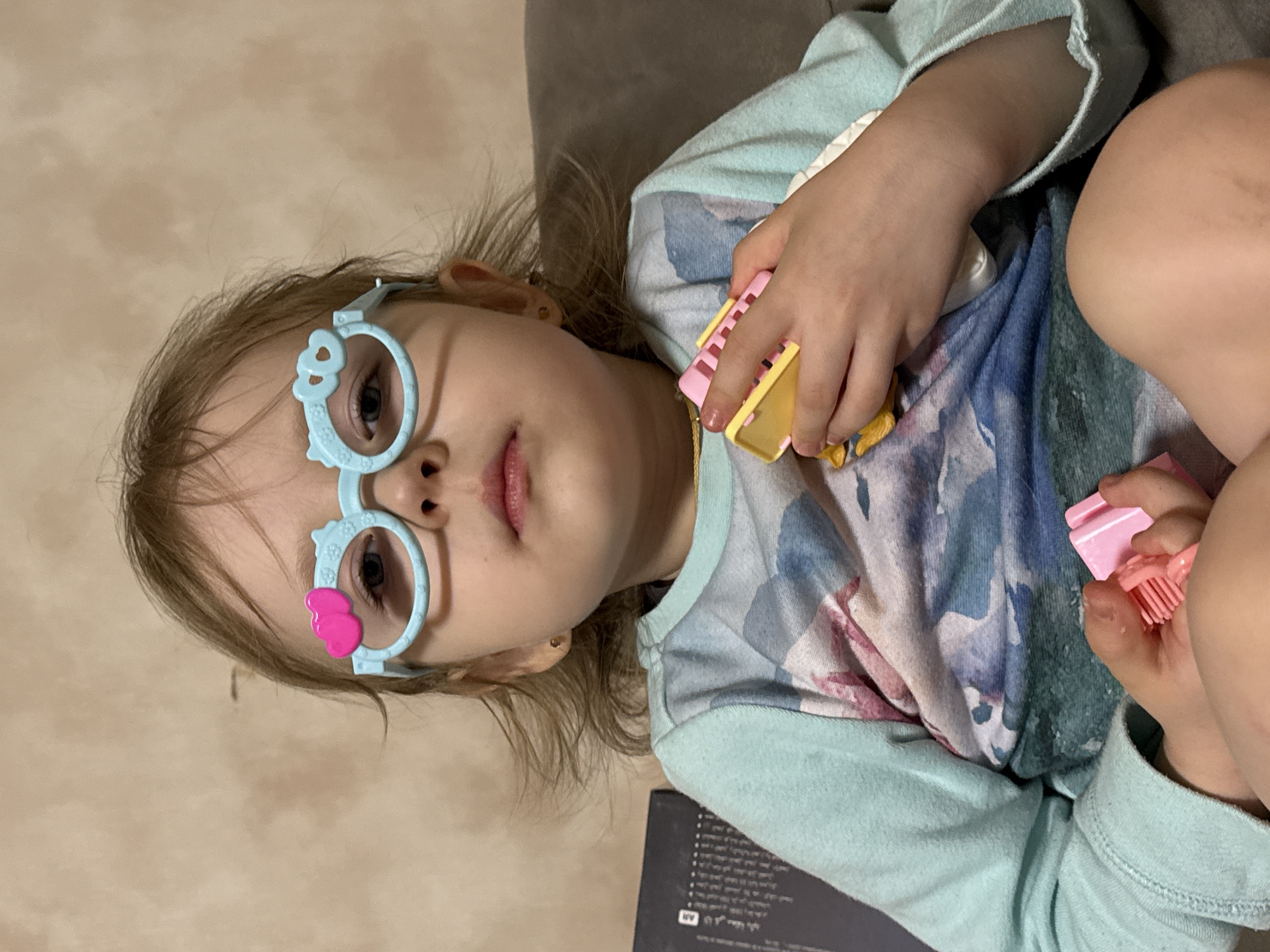 Child's playful moments captured in Russian household