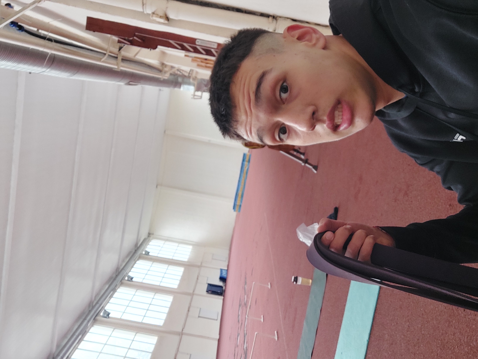 Man exercises with resistance band at Bulgarian athletic facility