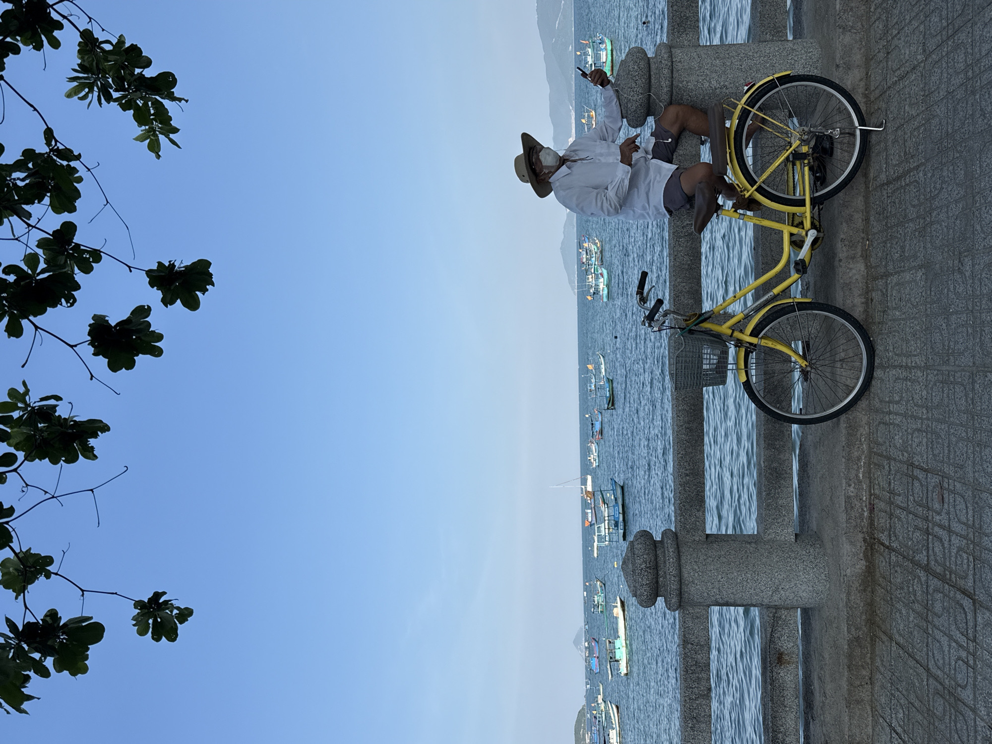 Quiet morning along Nha Trang's boat-filled waterfront promenade