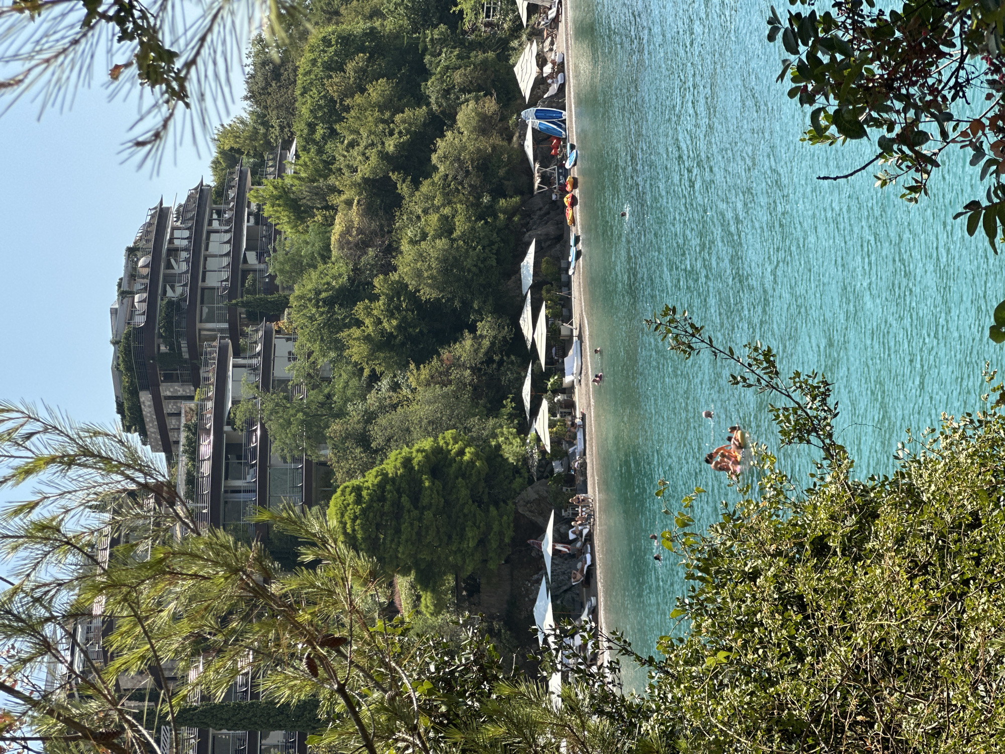 Budva's Adriatic coast in full summer swing — beaches, boats, and Old Town