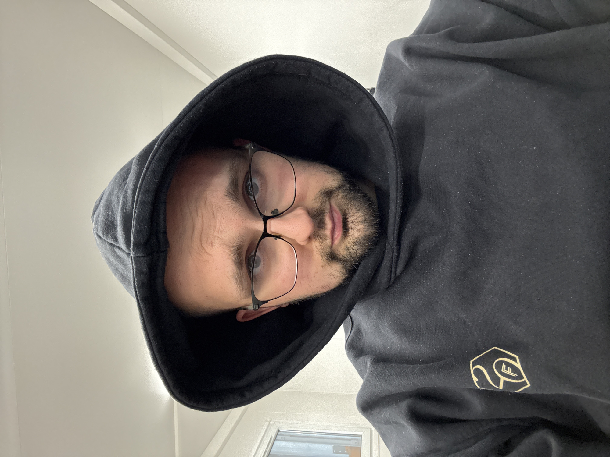 Man in black hoodie photographed in Epping Forest