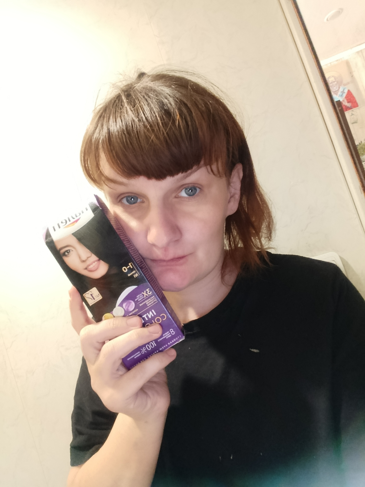 Woman documents hair dyeing process in Russian home