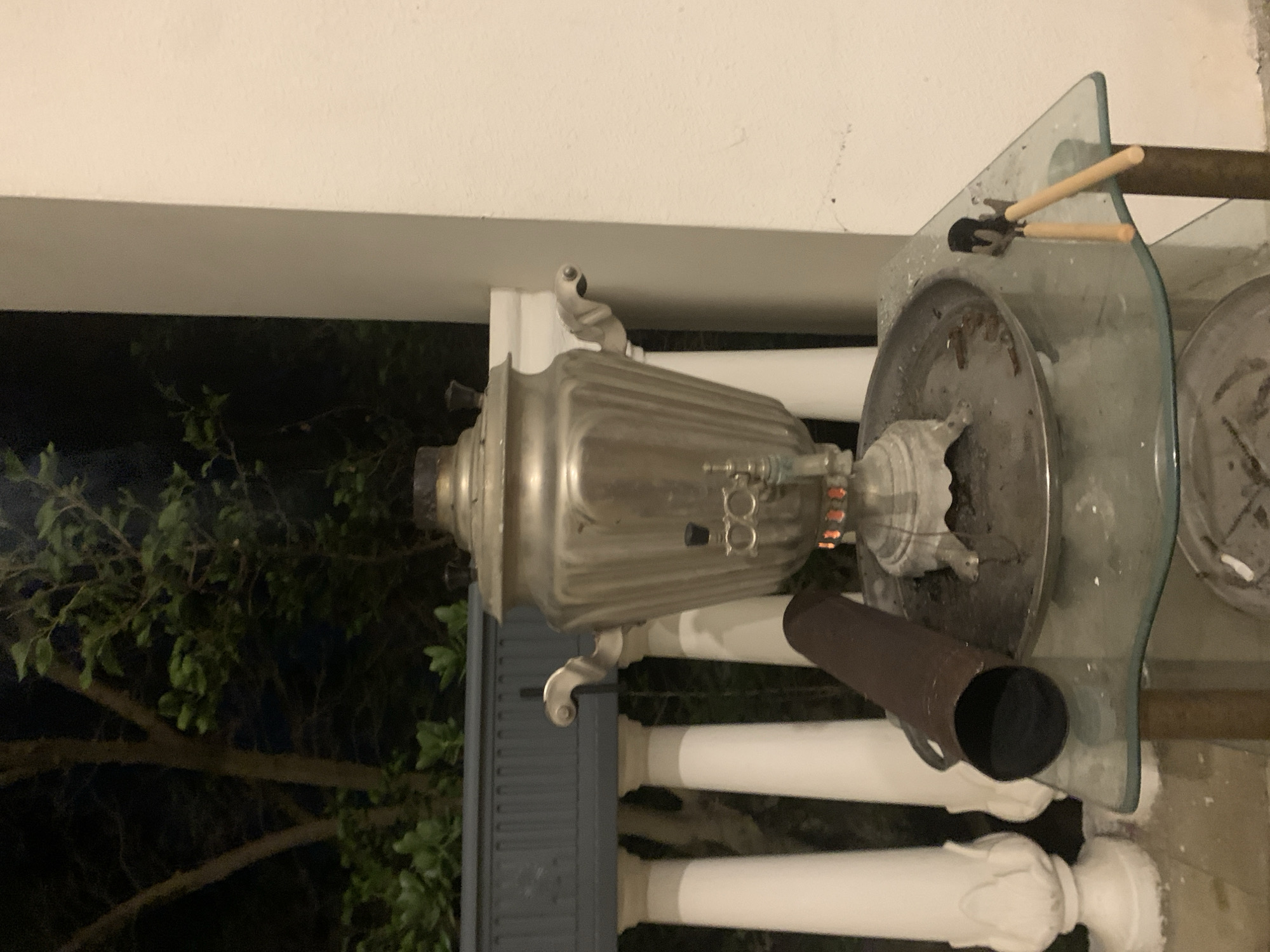 Samovar burning on a balcony in Khazar Raion at night