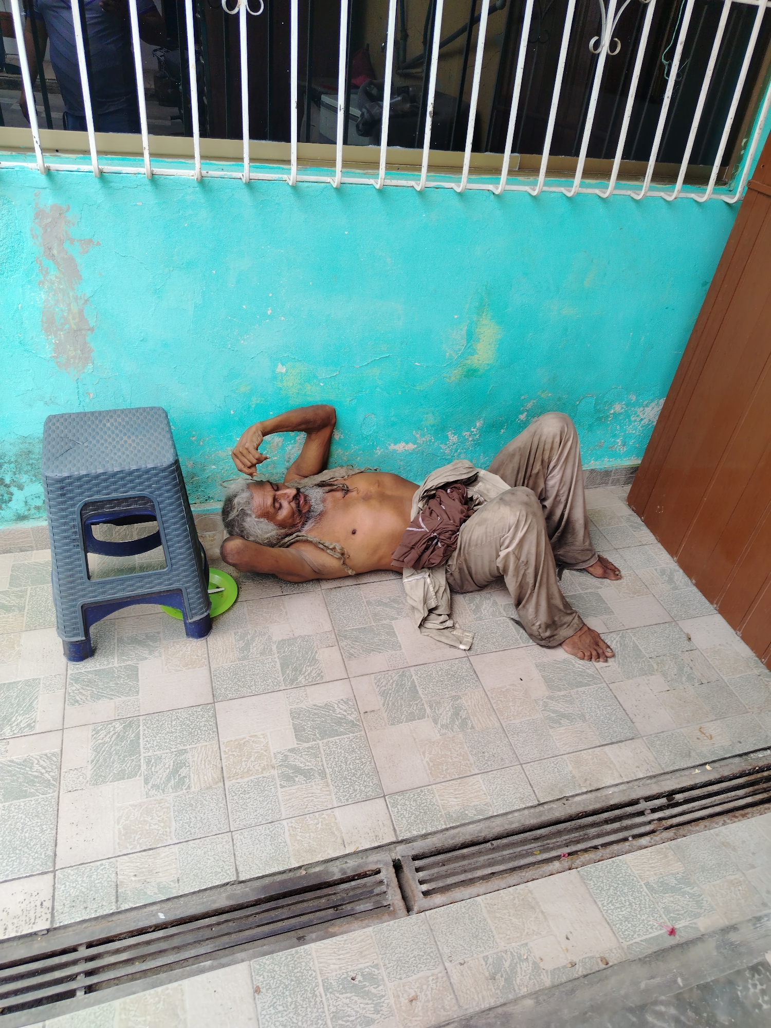 Man lies on floor in Tinaquillo, Venezuela