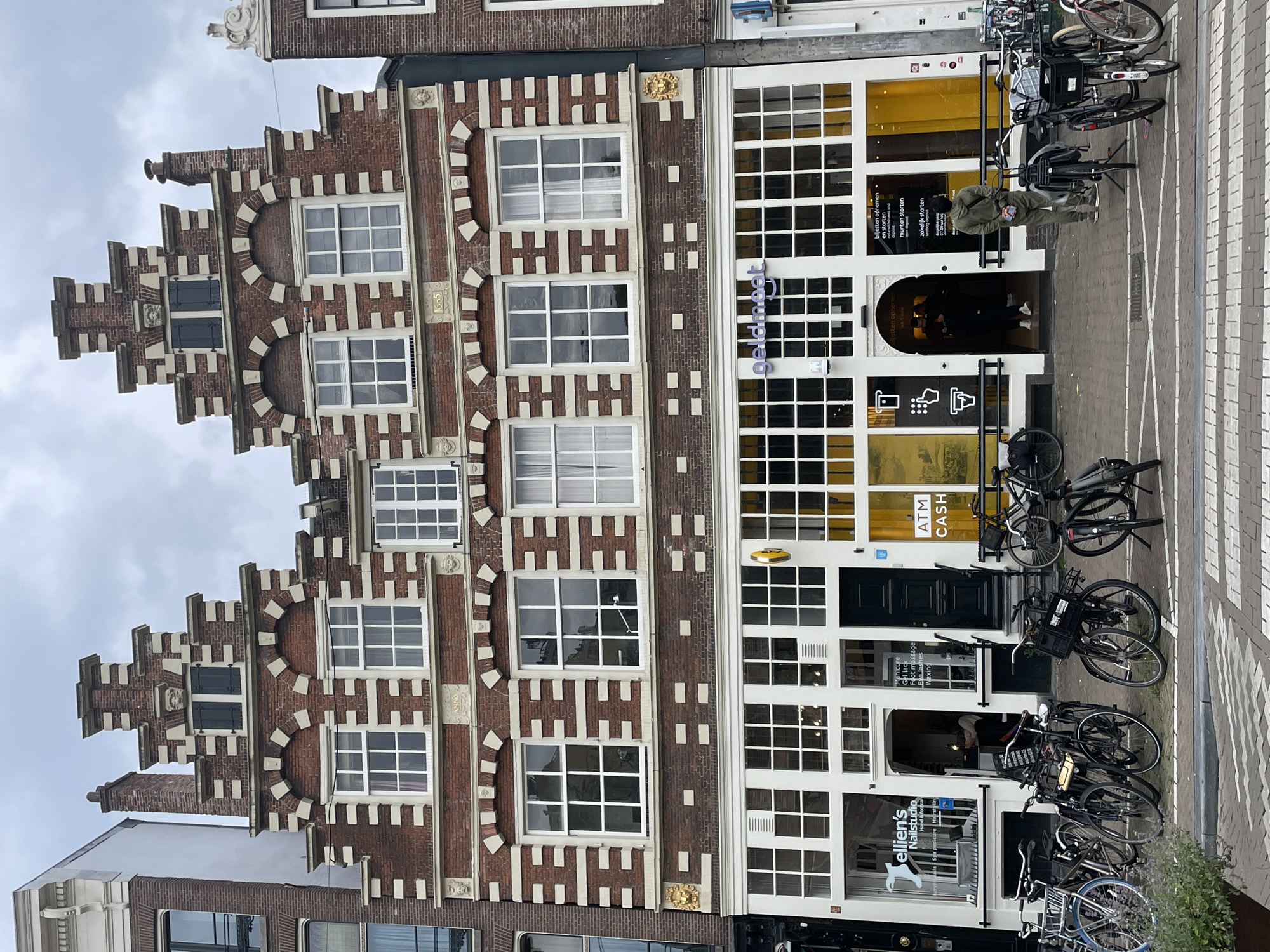 Amsterdam street scenes documented showing traditional architecture, local cafe