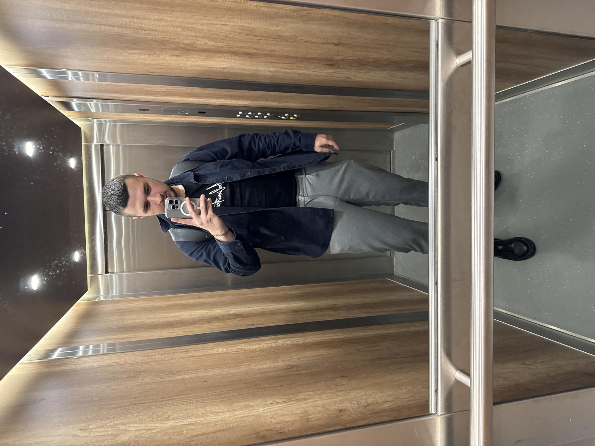 Sofia resident documents morning routine with elevator selfie, coffee break