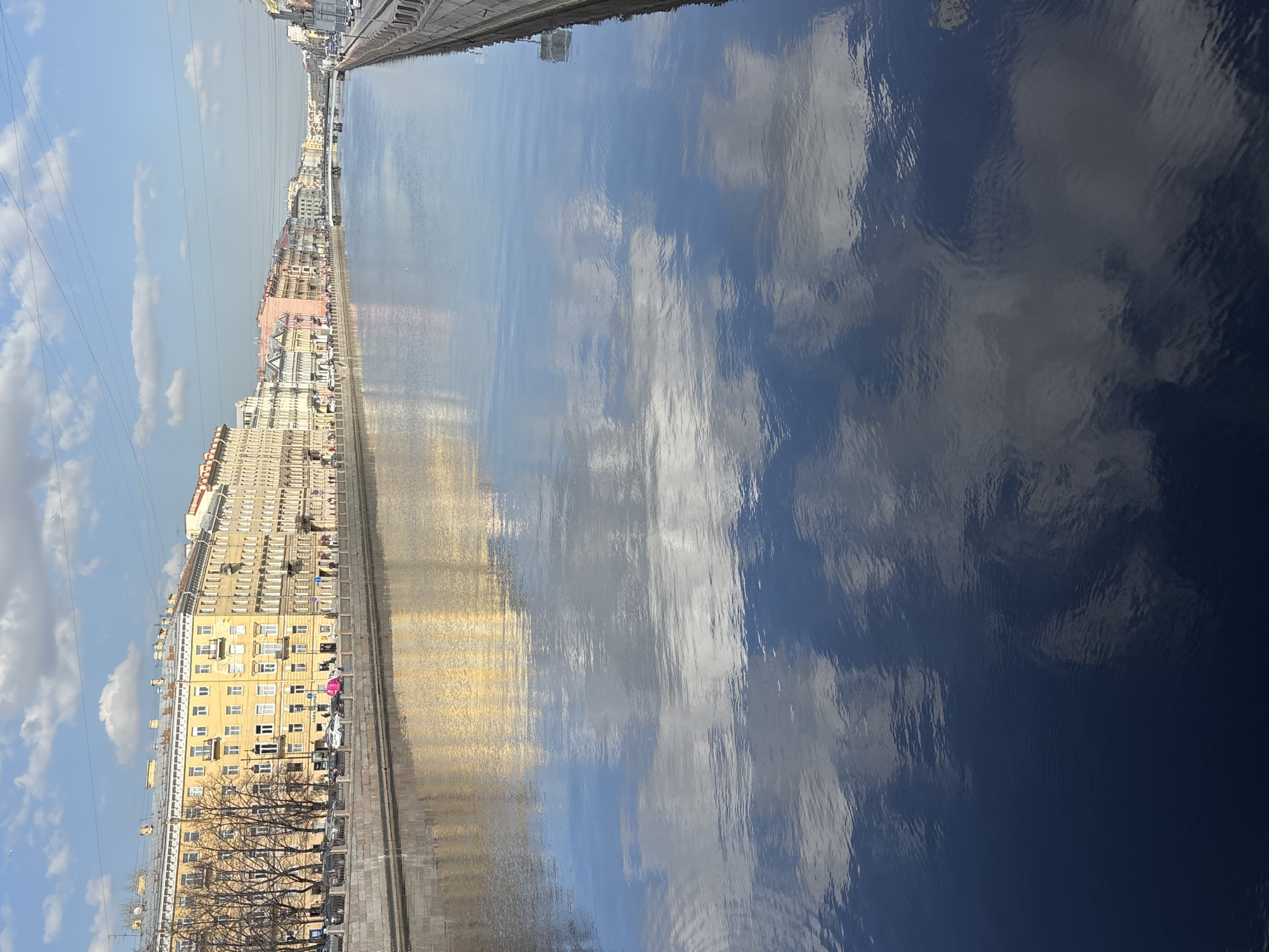 Tourist captures selfie, street scenes along Saint Petersburg canals
