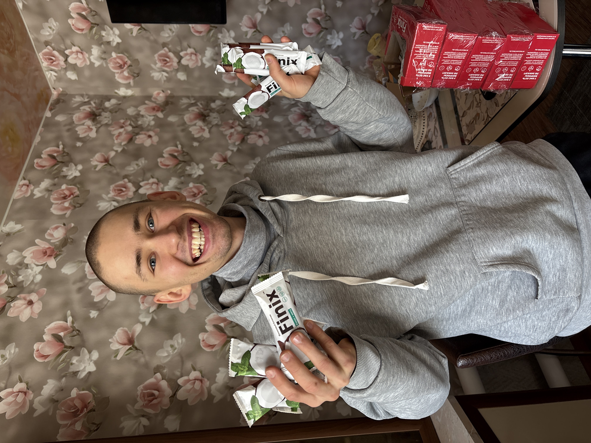 Man displays Finix protein bars in Ulyanovsk home