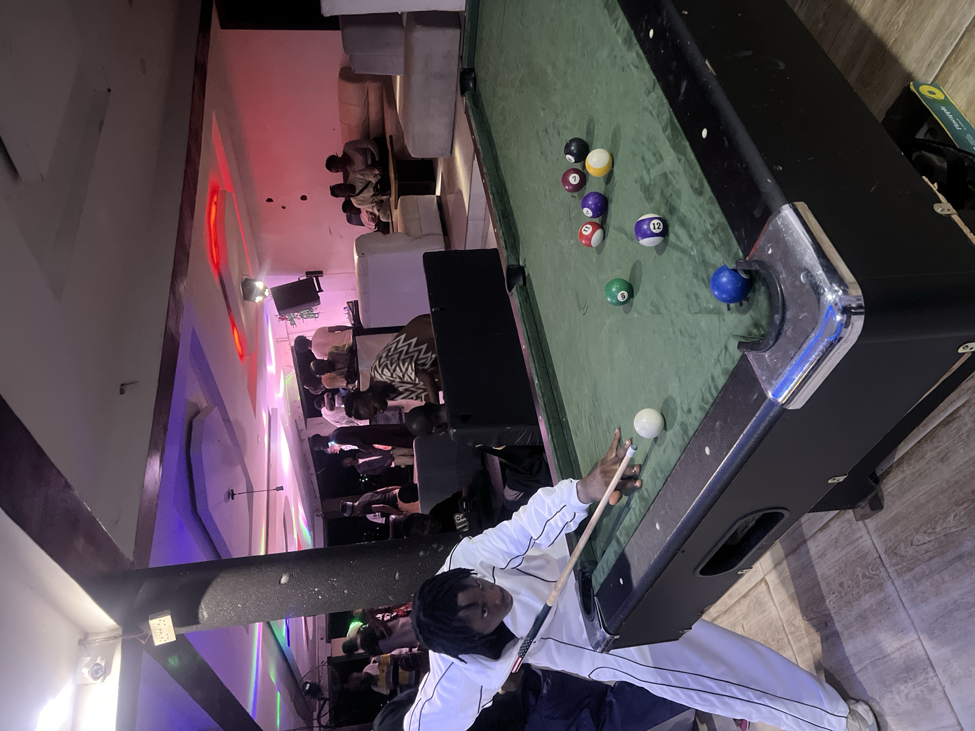 Evening social gathering with pool games at Howayi bar