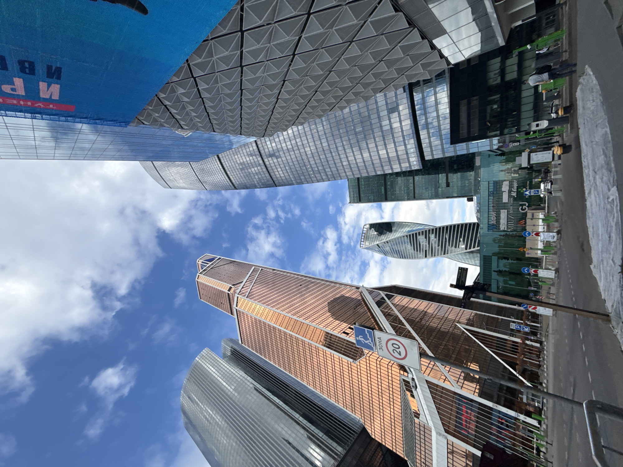 Observer documents Moscow City skyscrapers from Khimki under cloudy skies