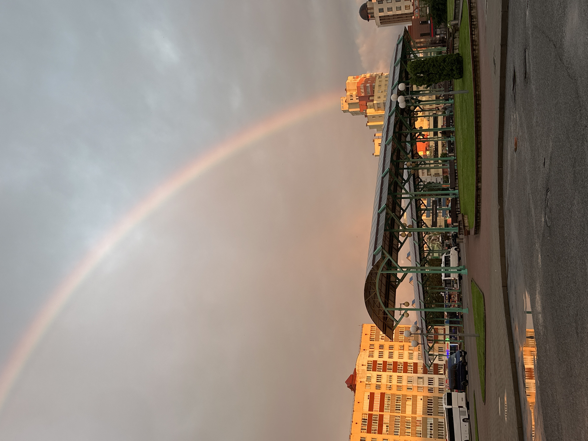 Rainbow over Hrodna at sunset, streaked with pink and orange