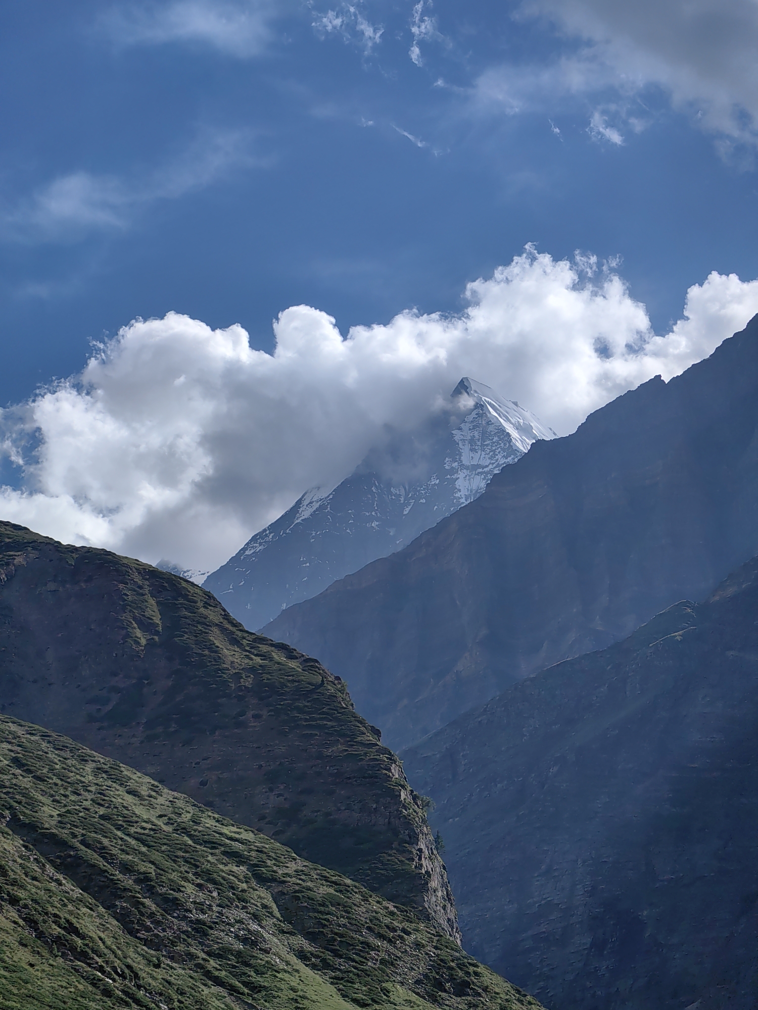 Sissu valley: green slopes, glacial river, and Himalayan peaks