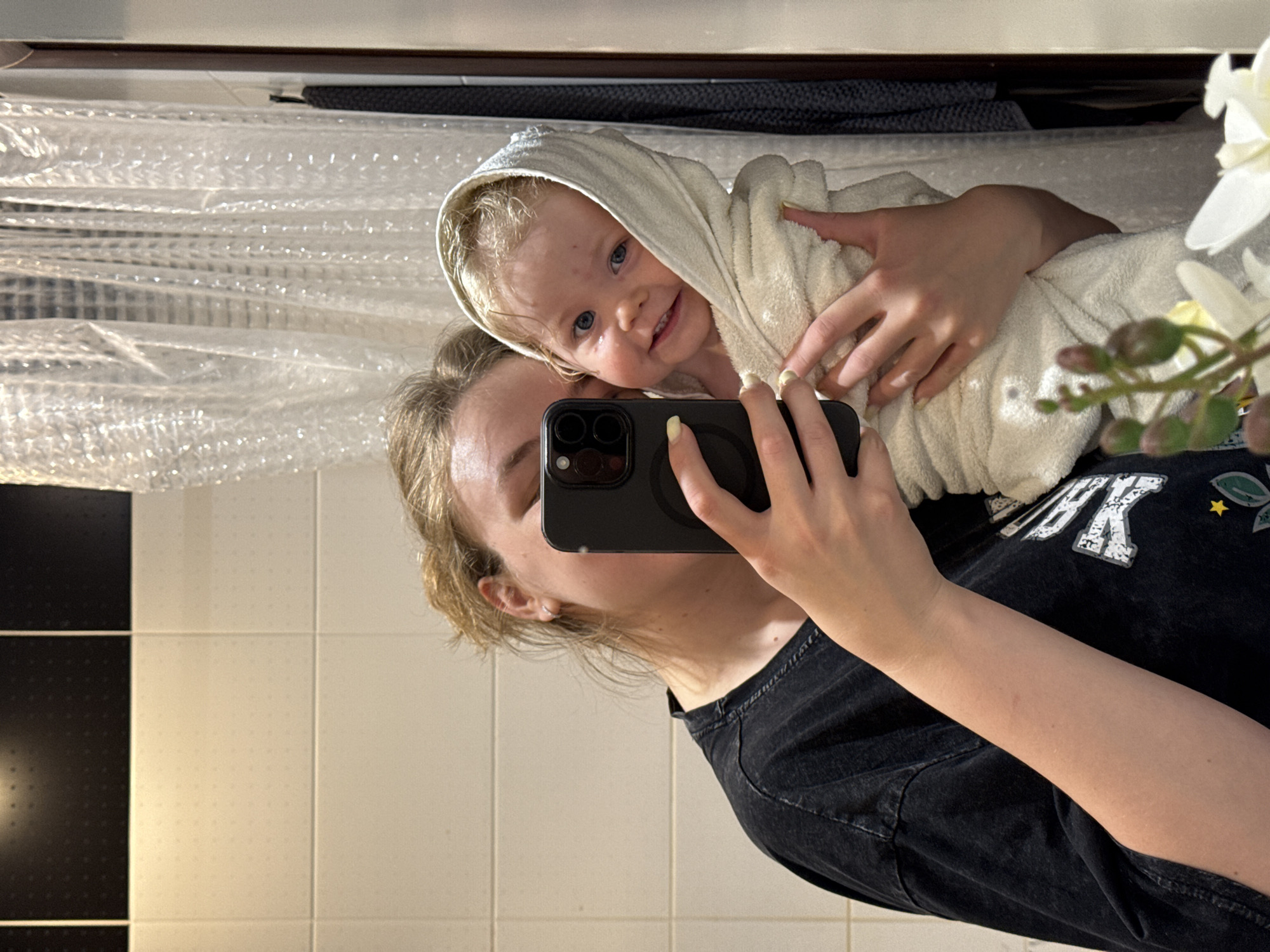 Parent documents toddler's bath time routine in Vladimir