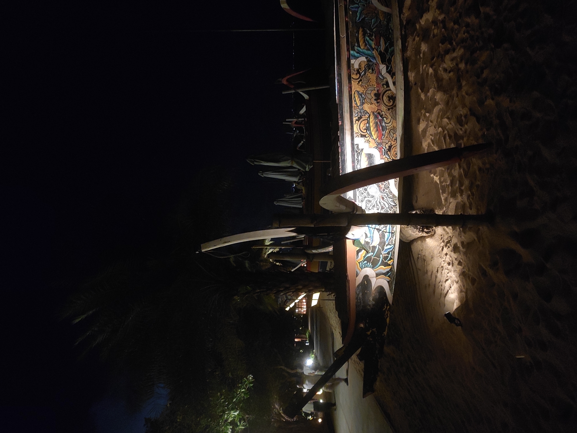 Illuminated decorated cart spotted in nighttime Denpasar