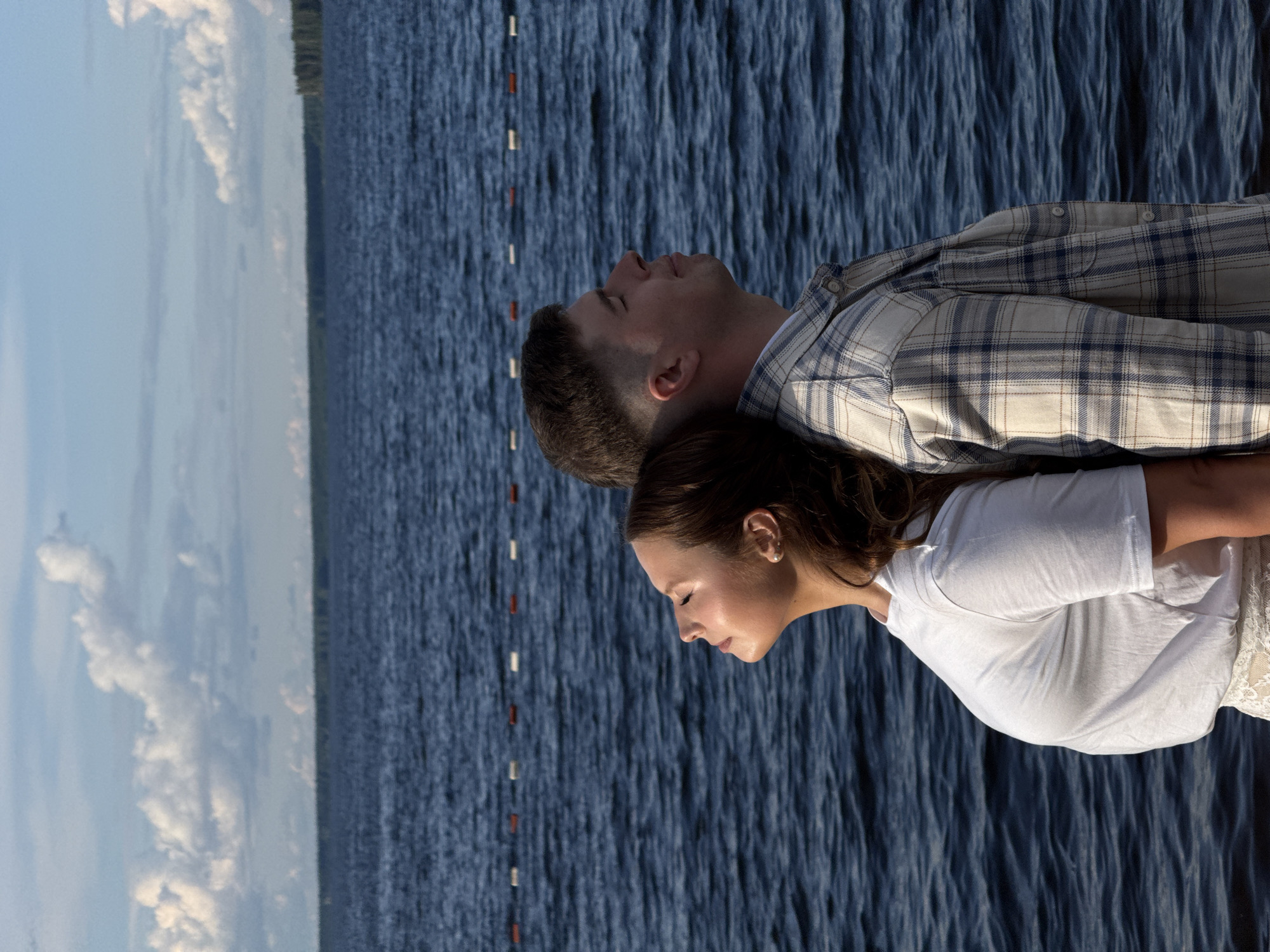 Couple enjoys romantic afternoon by lake in Chaikovsky, Russia