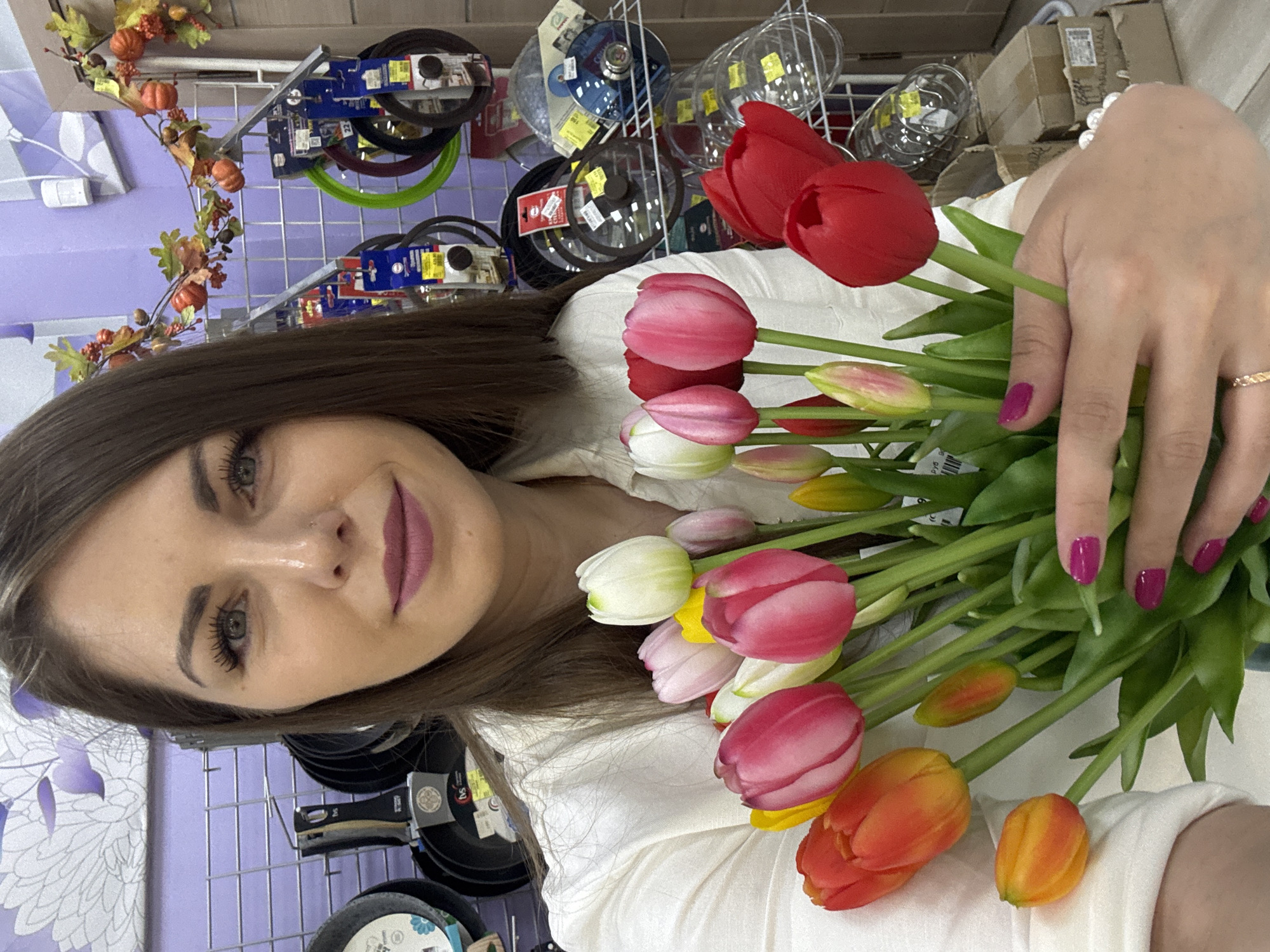 Woman documents flower shopping experience in Klin retail center