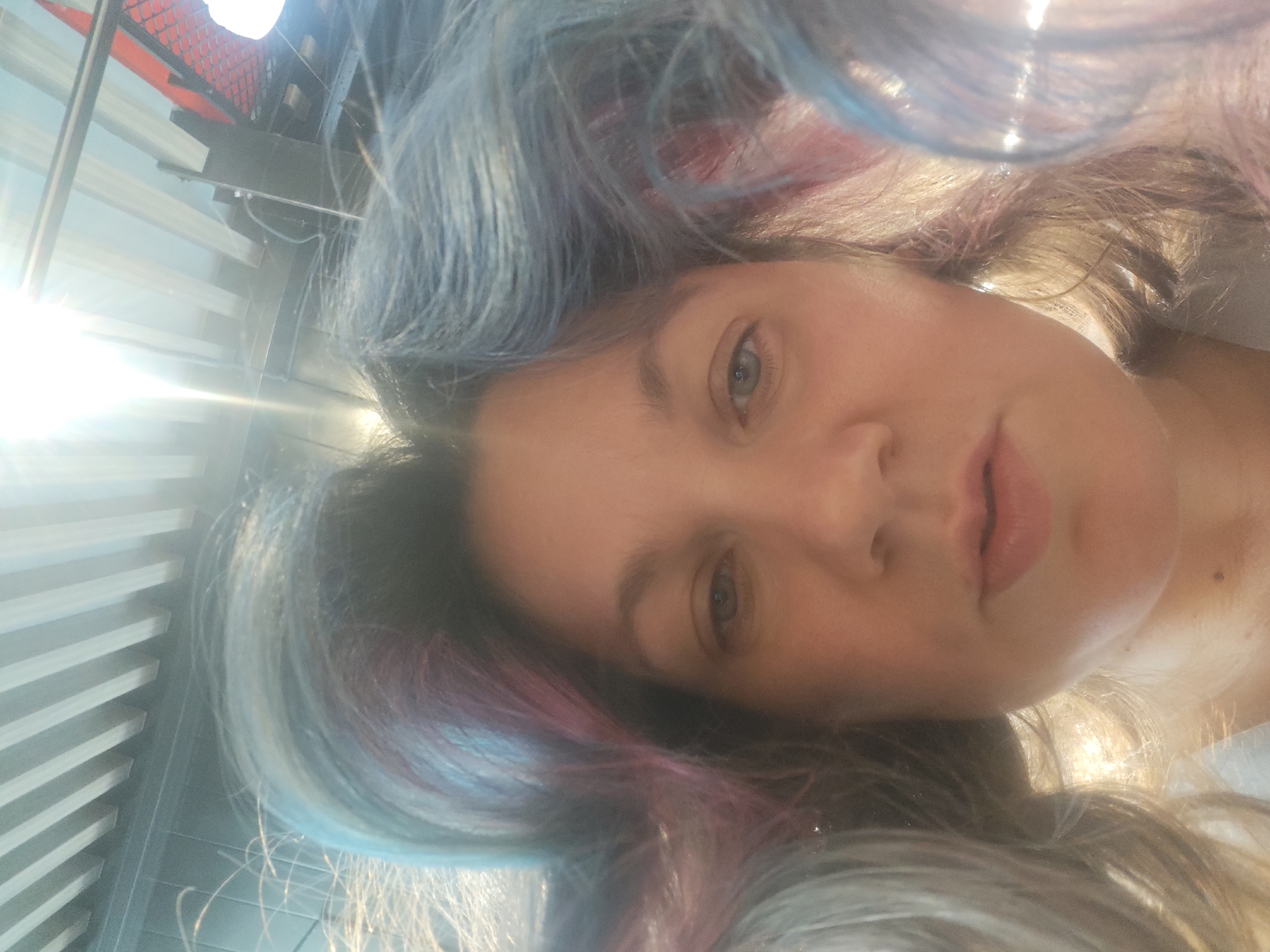 Woman with colorful hair photographed in Sholokhovo, Russia