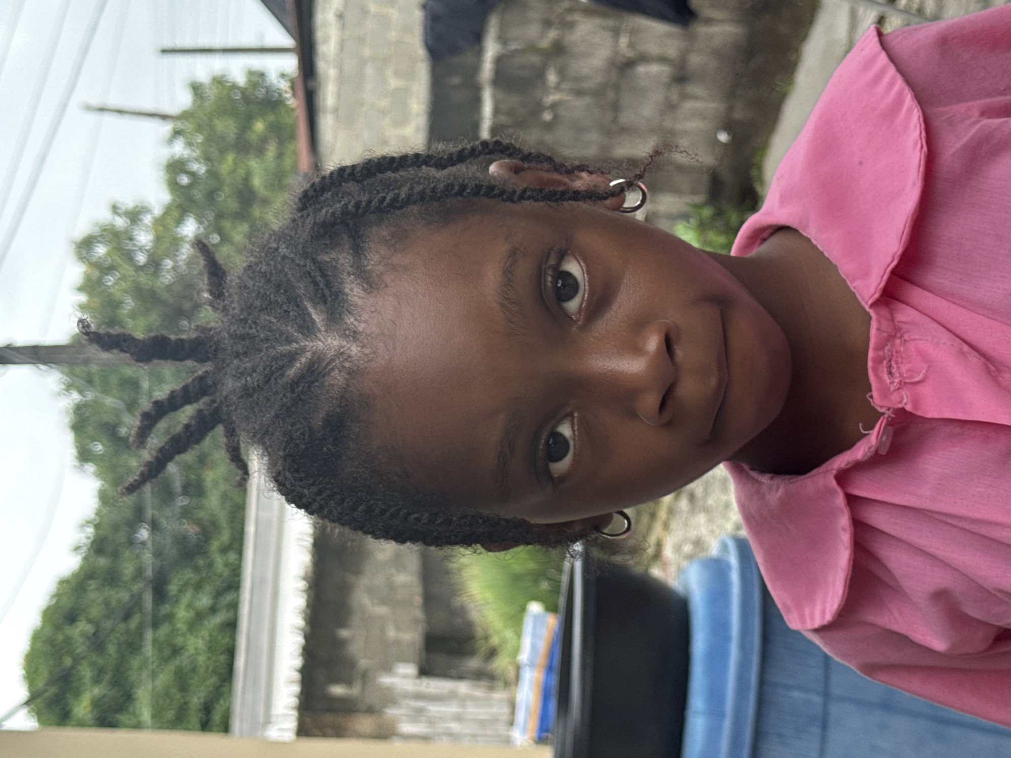 Everyday street life in Ado, Nigeria — vendors, students, transit