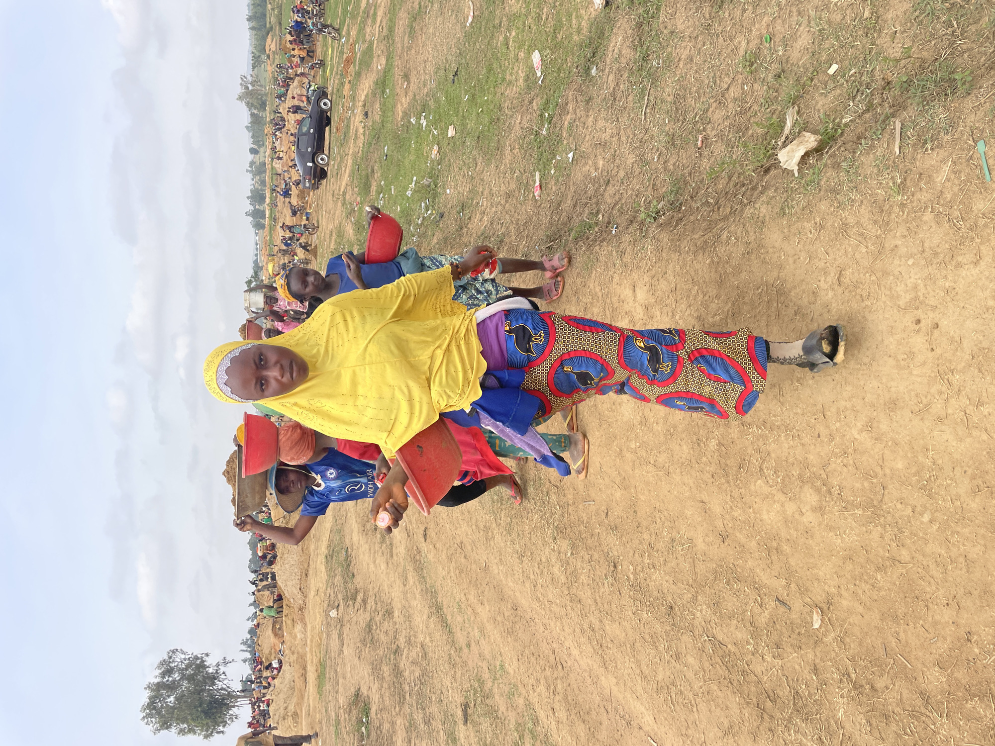 Group gathers in dry grassland in Durumi, Nigeria