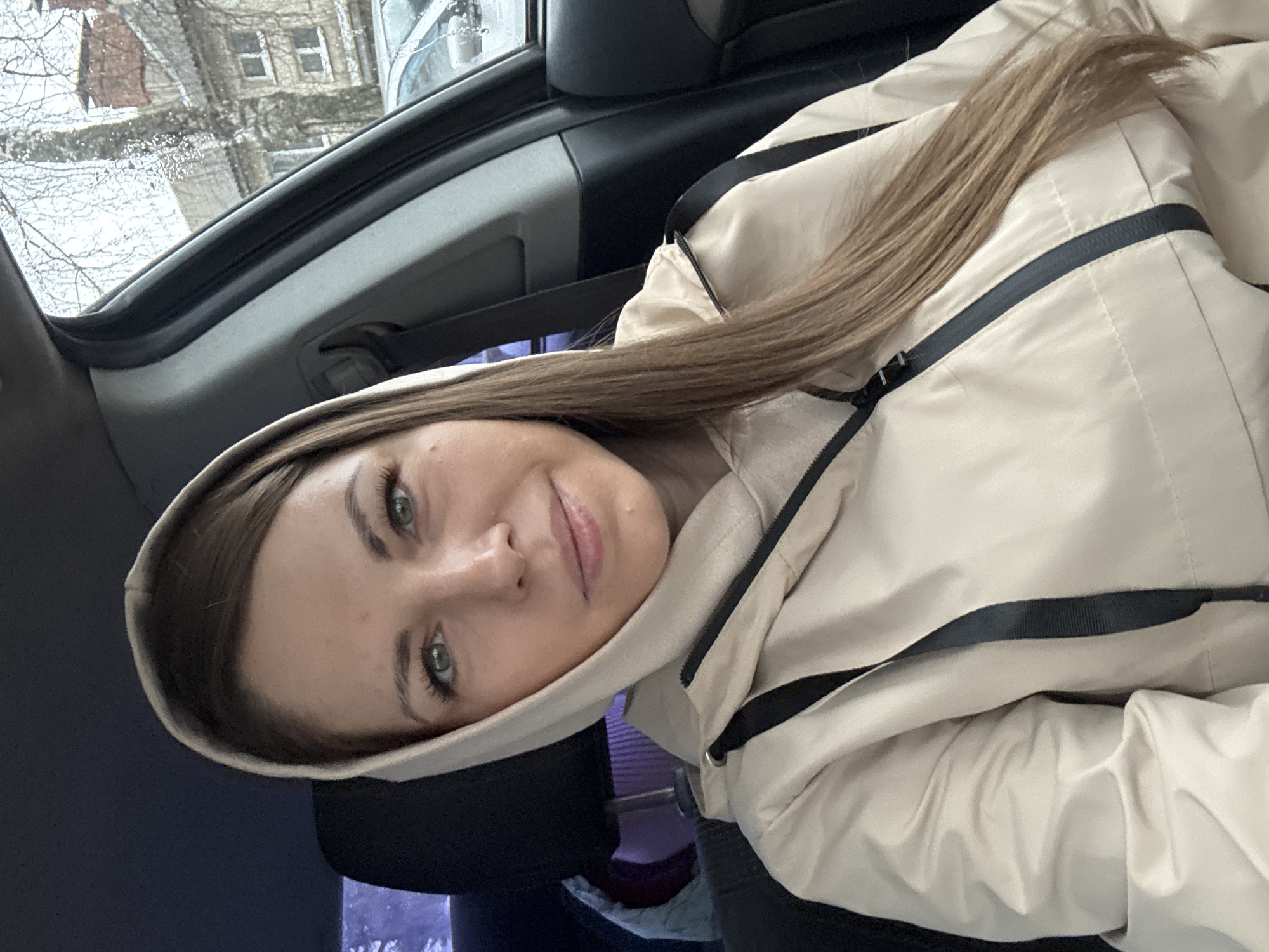 Woman photographed in car in Раздолье, Russia early morning