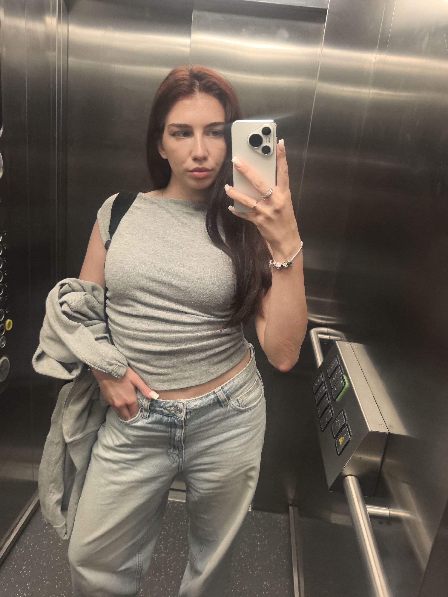 Woman takes selfie in elevator in Bogomilovo, Bulgaria