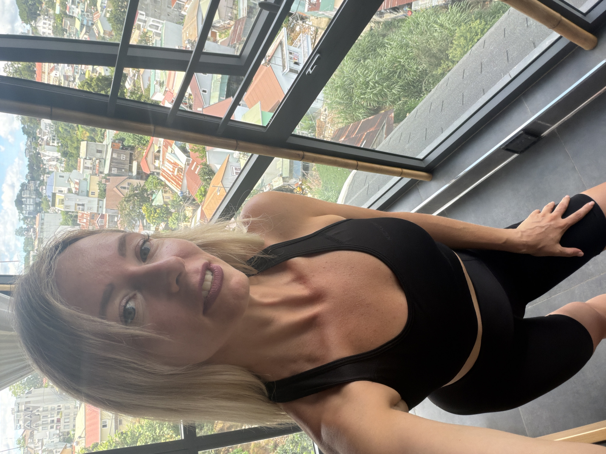 Fitness studio selfies with Da Lat city views in the background