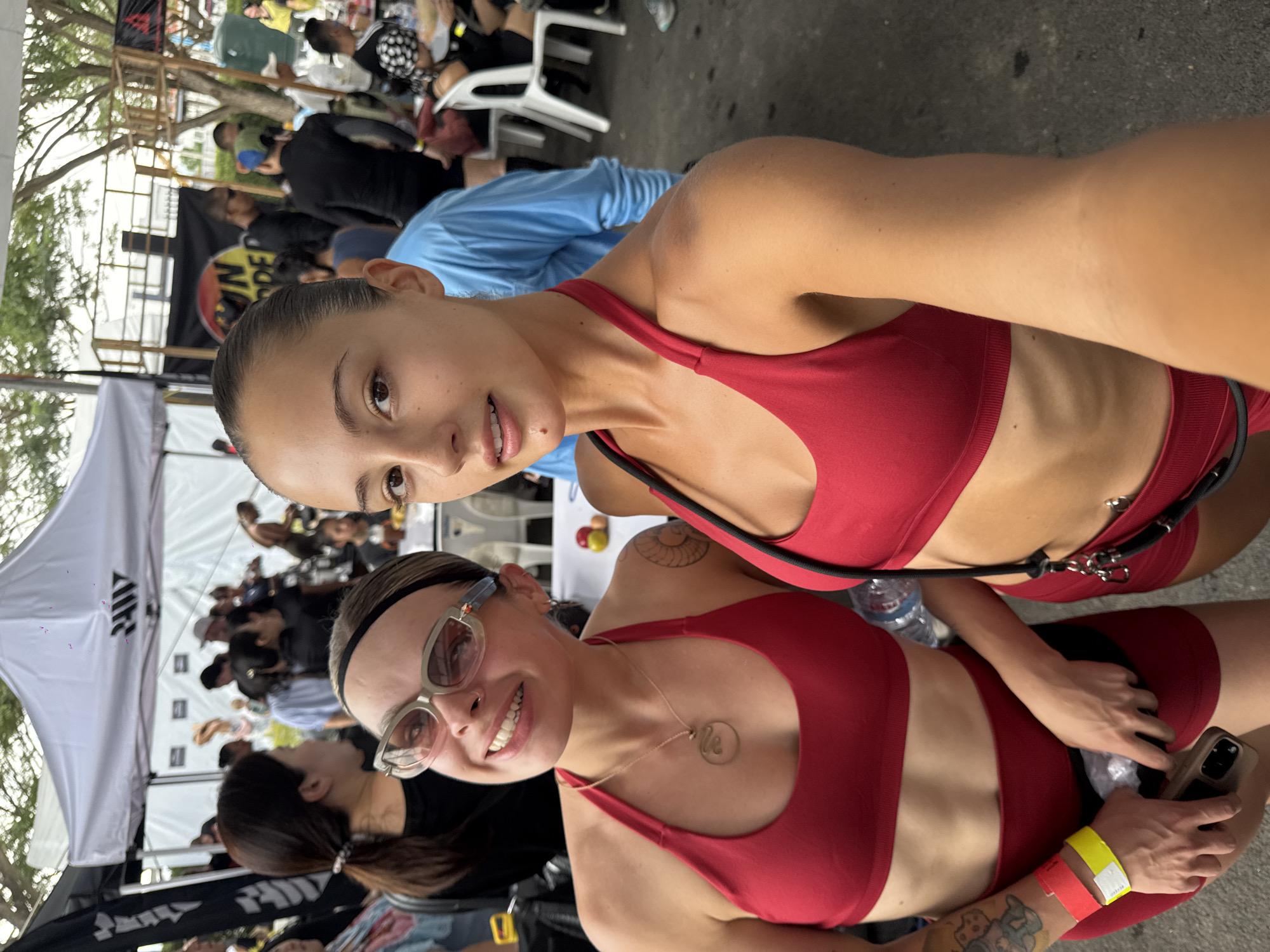 Women in red athletic wear take selfie in Thailand