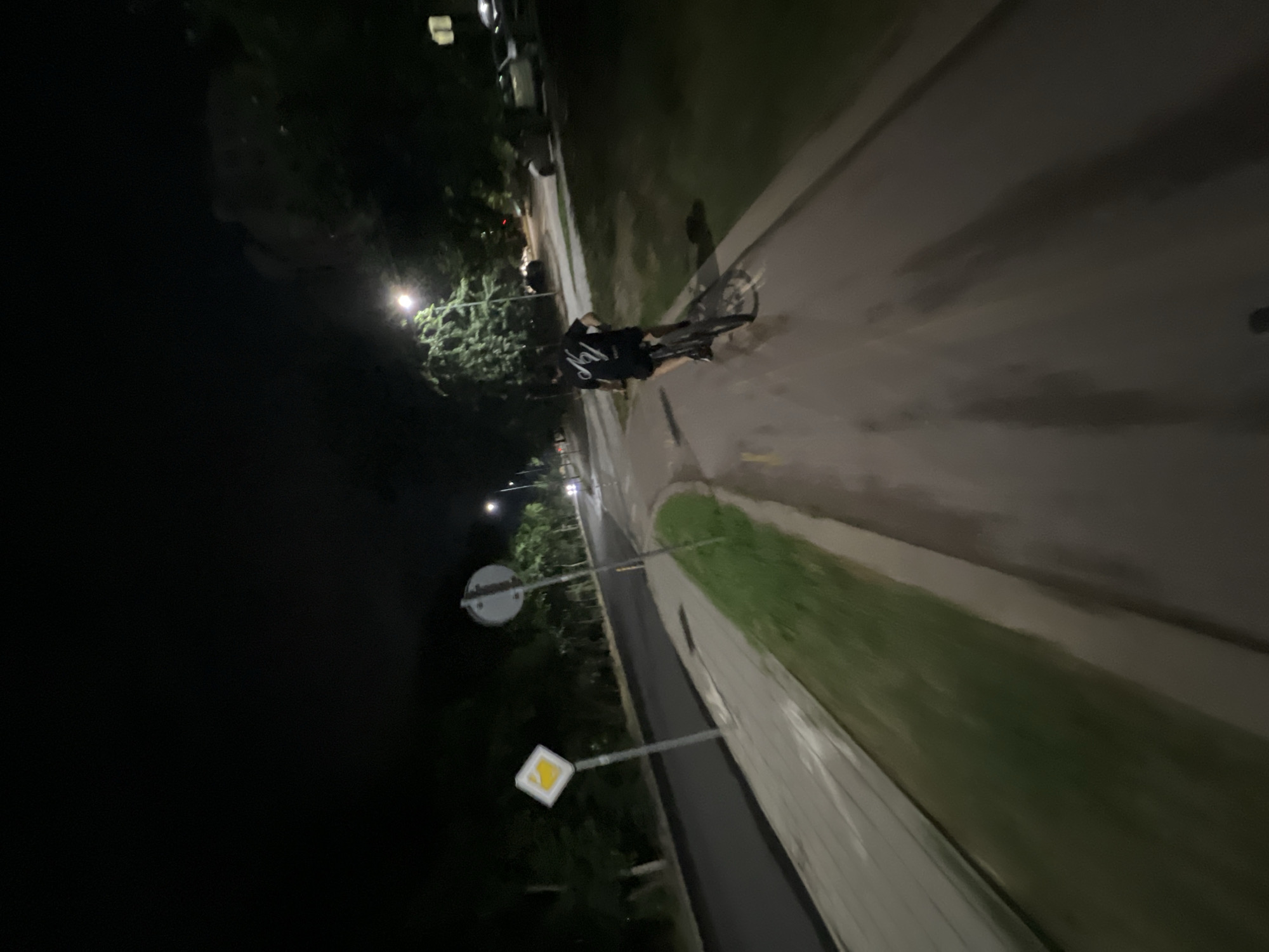 Nighttime cycling through Plovdiv's lit park paths and streets