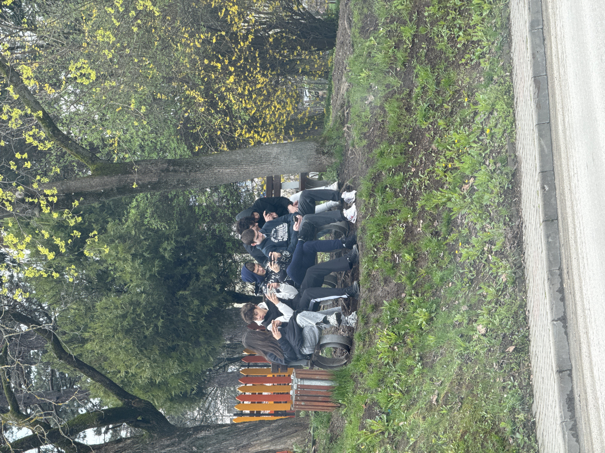 Young people gather on park bench in Veliko Tarnovo