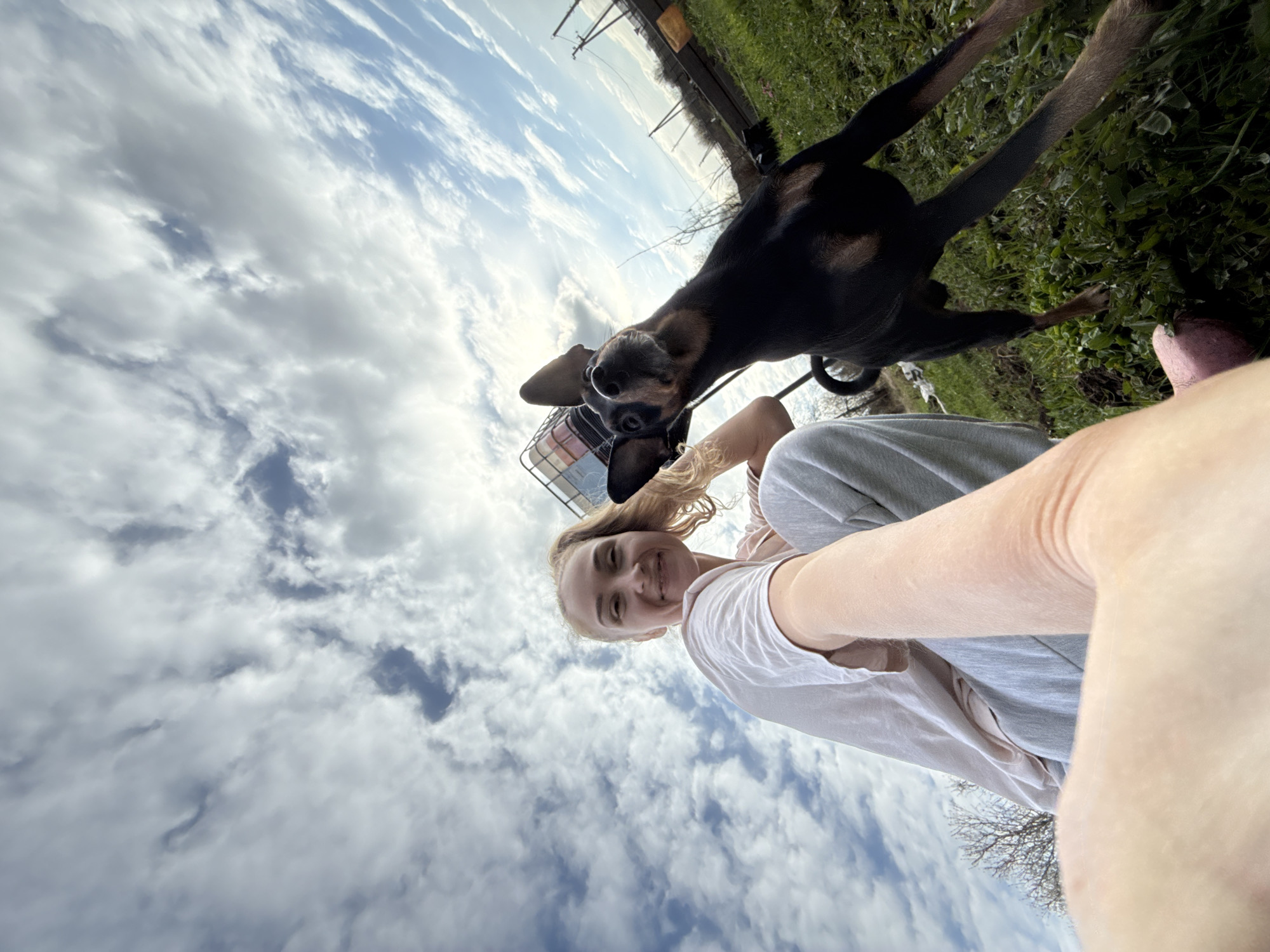 Woman takes selfie, cat spotted amid construction in Russian village