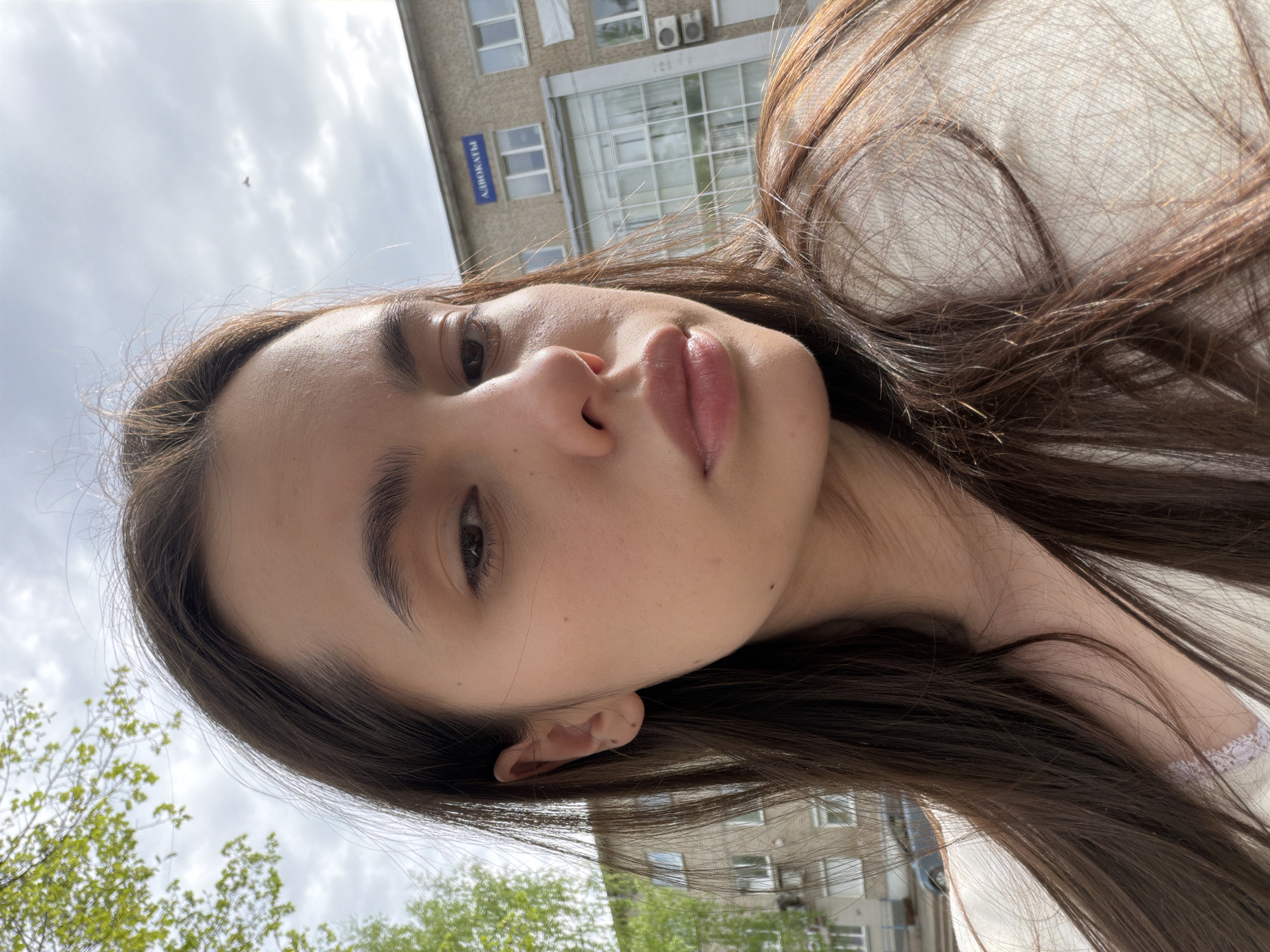 Woman photographs herself in Chaikovsky park amid urban debris
