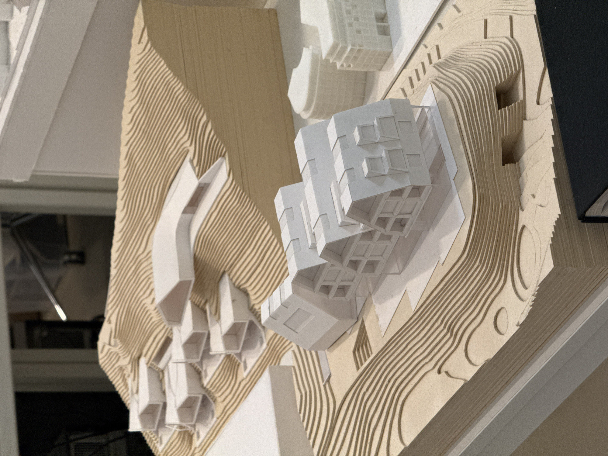 Architectural model with geometric building complex observed in Milan