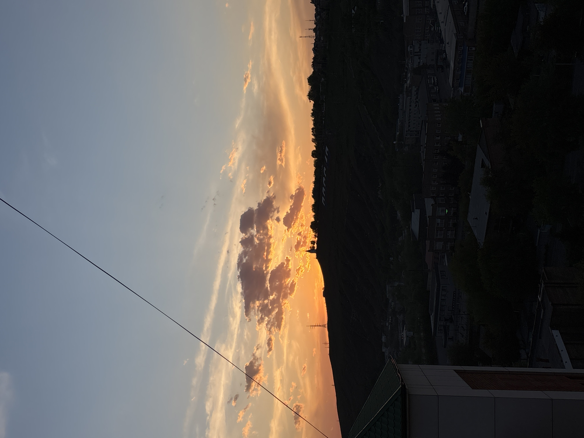 Vibrant sunset lights up Krasnoyarsk sky over Yenisey River