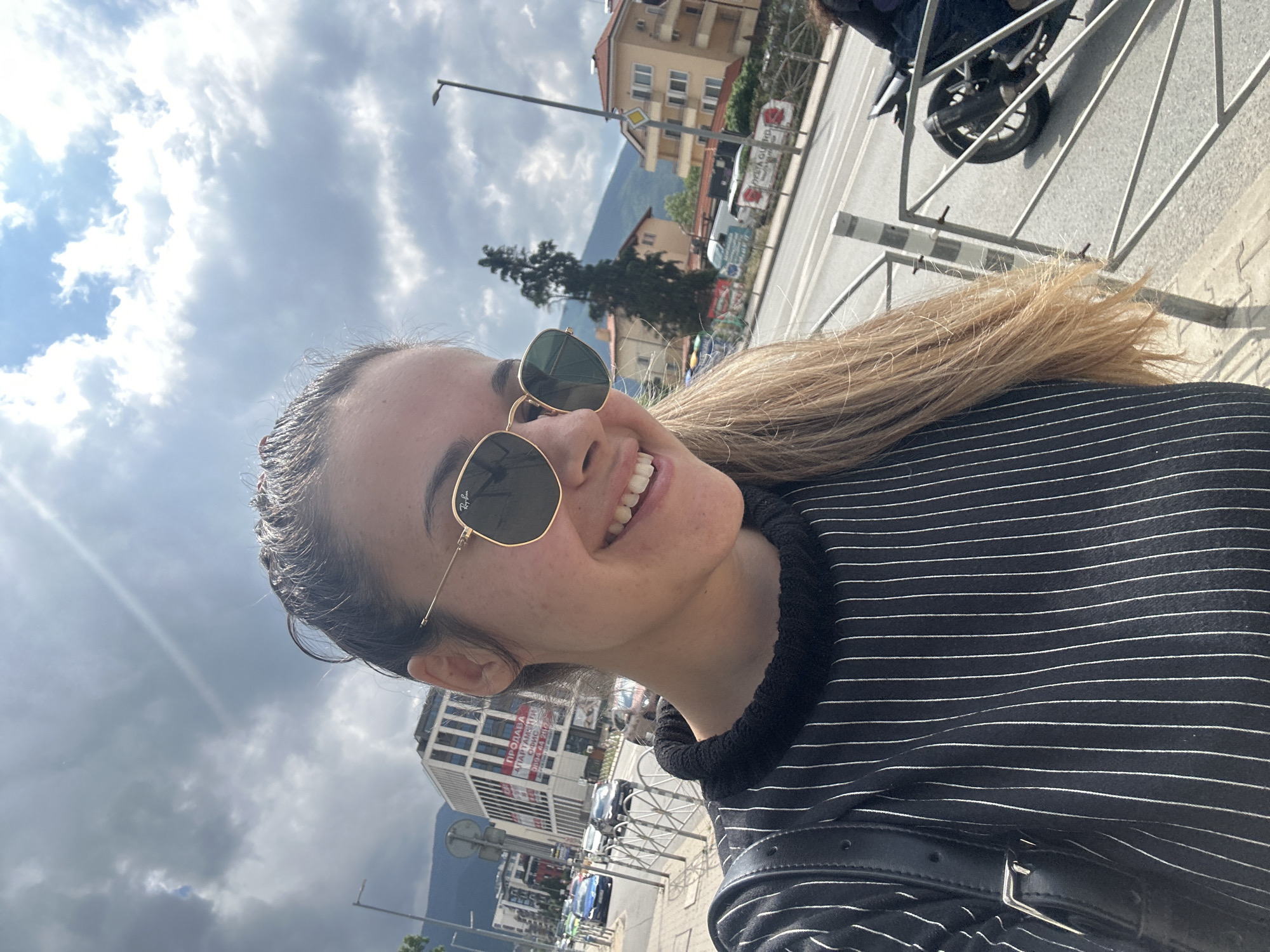 Woman takes creative selfies on sunny Sofia street
