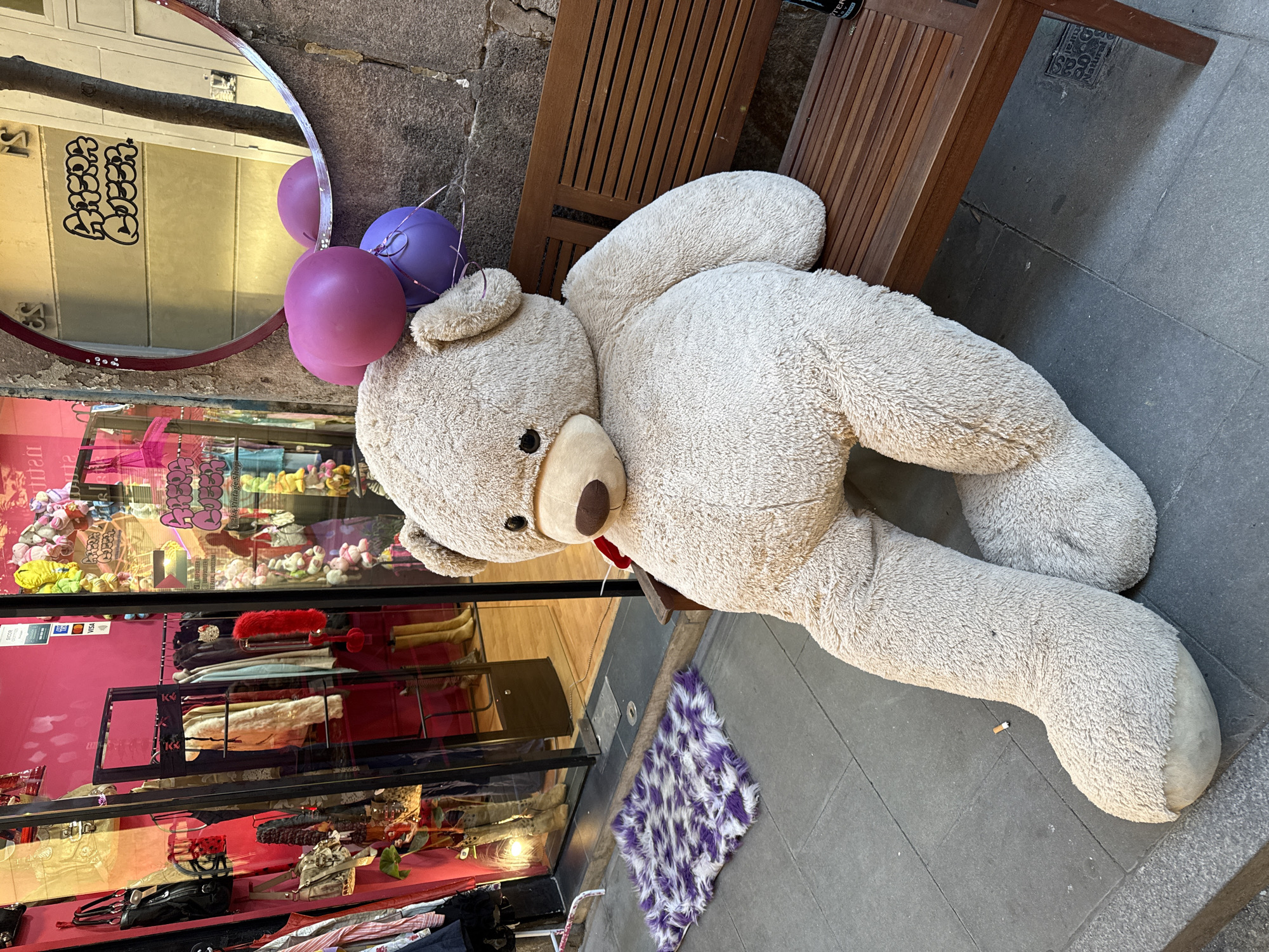 Teddy bear with balloons spotted on Barcelona street bench