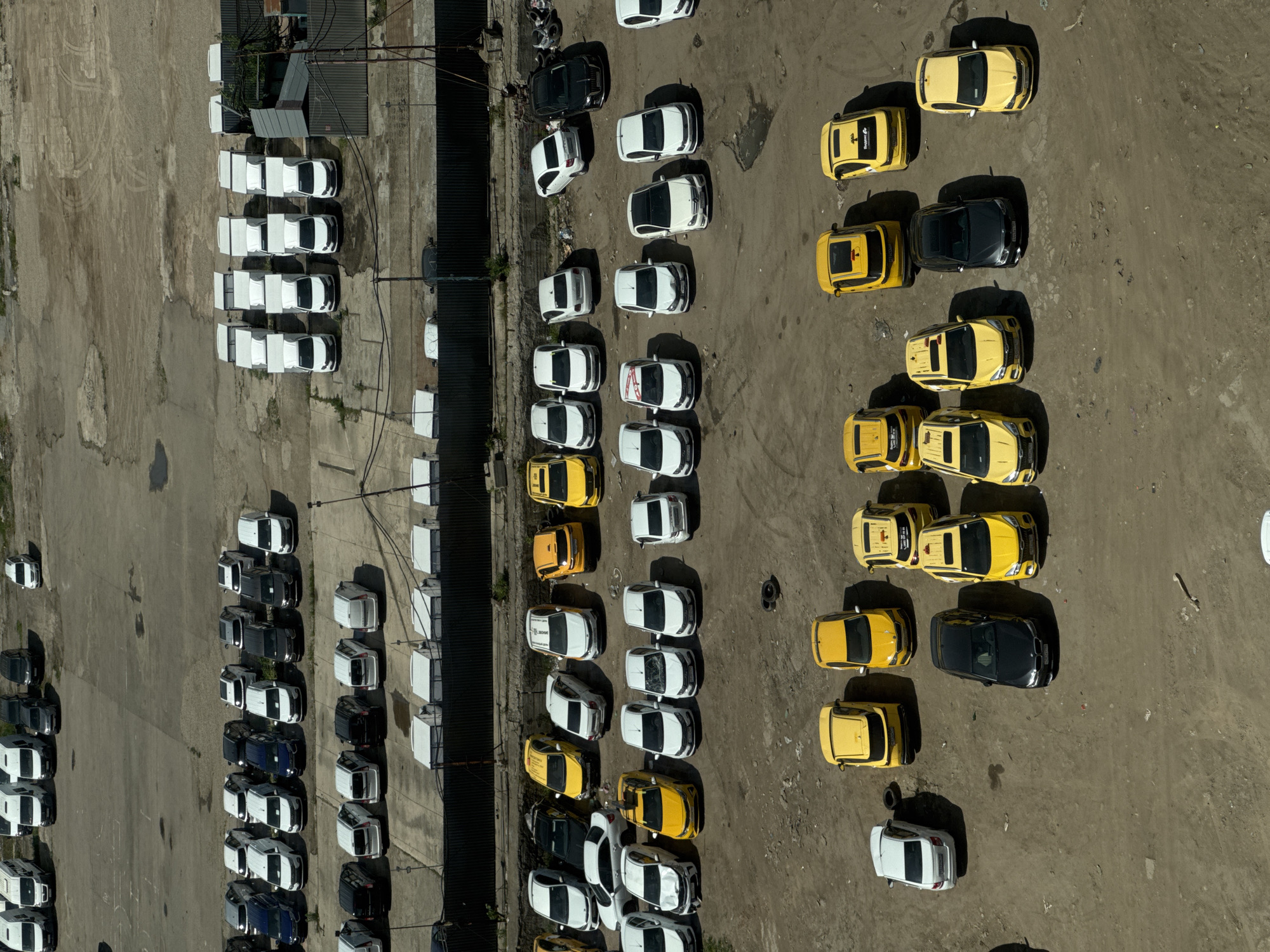 Aerial view captures busy parking lot, tall buildings in Ukromne