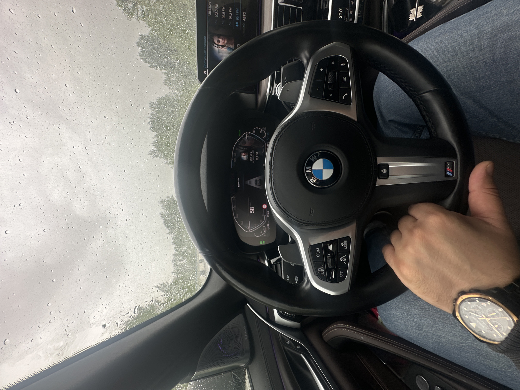 BMW driver navigates rainy roads at high speed
