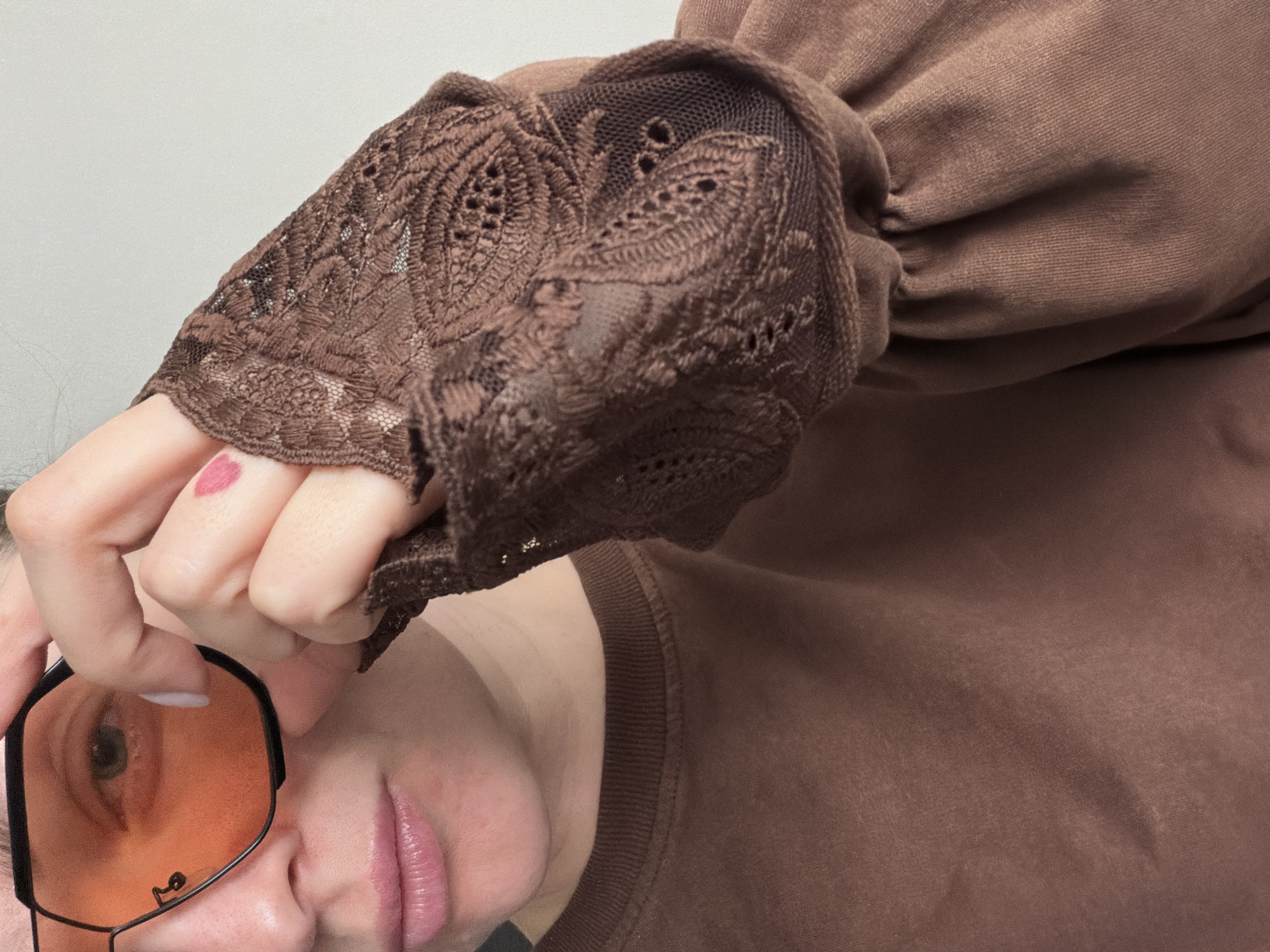 Woman poses with orange-tinted sunglasses in Moscow