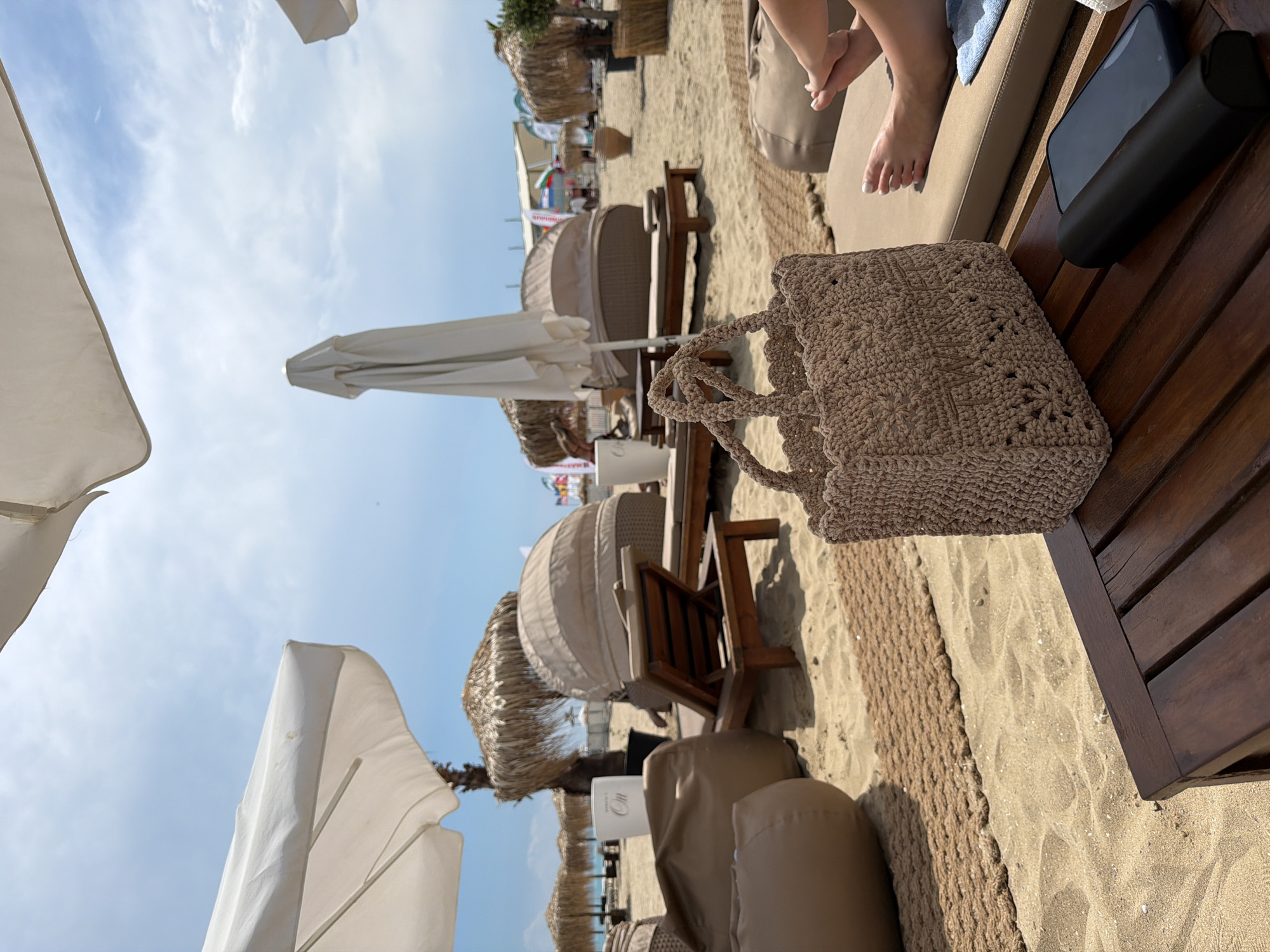Beach day captured at Bulgarian resort with typical leisure items