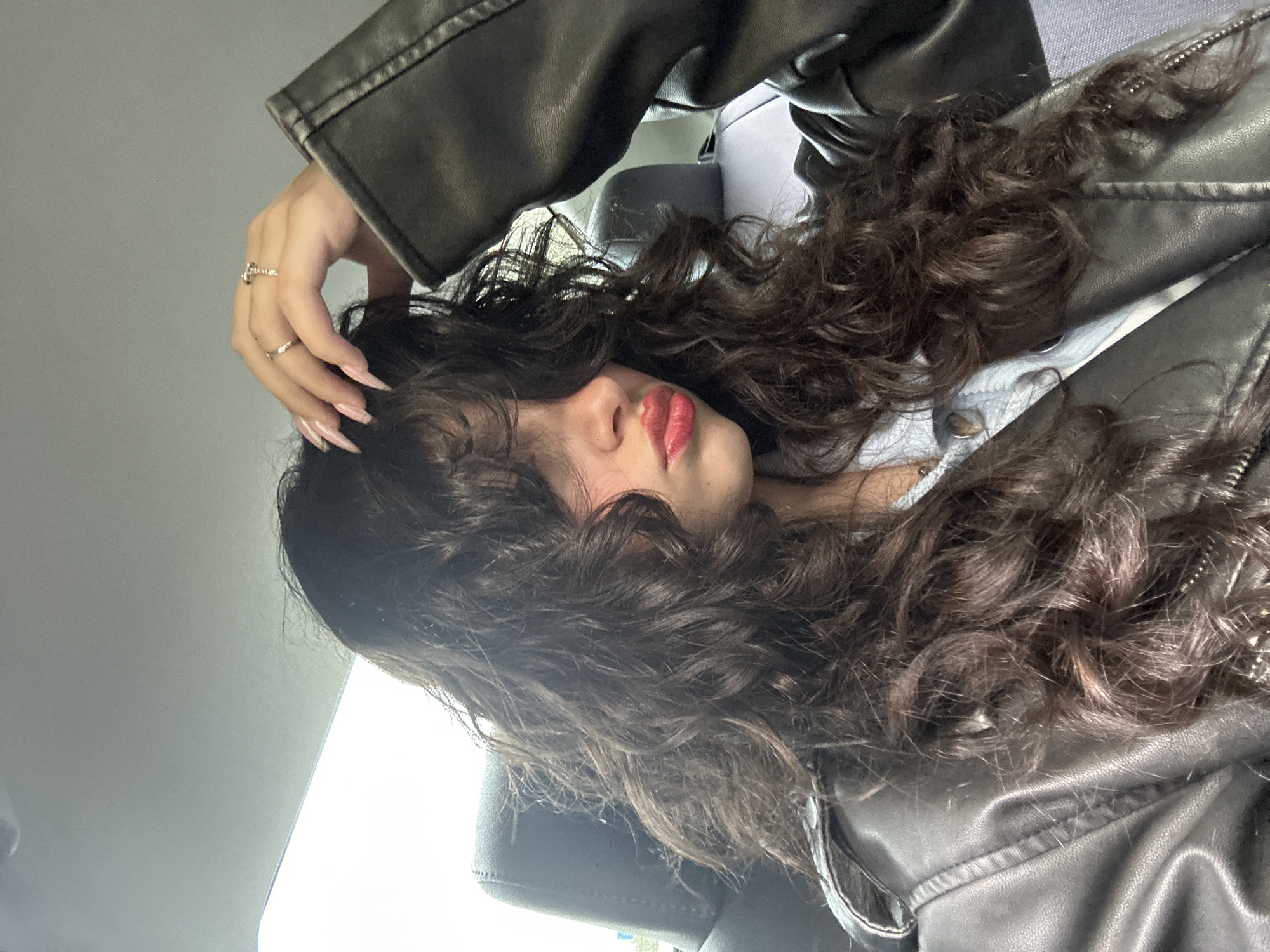 Woman photographed in car backseat selfie session in Yerevan