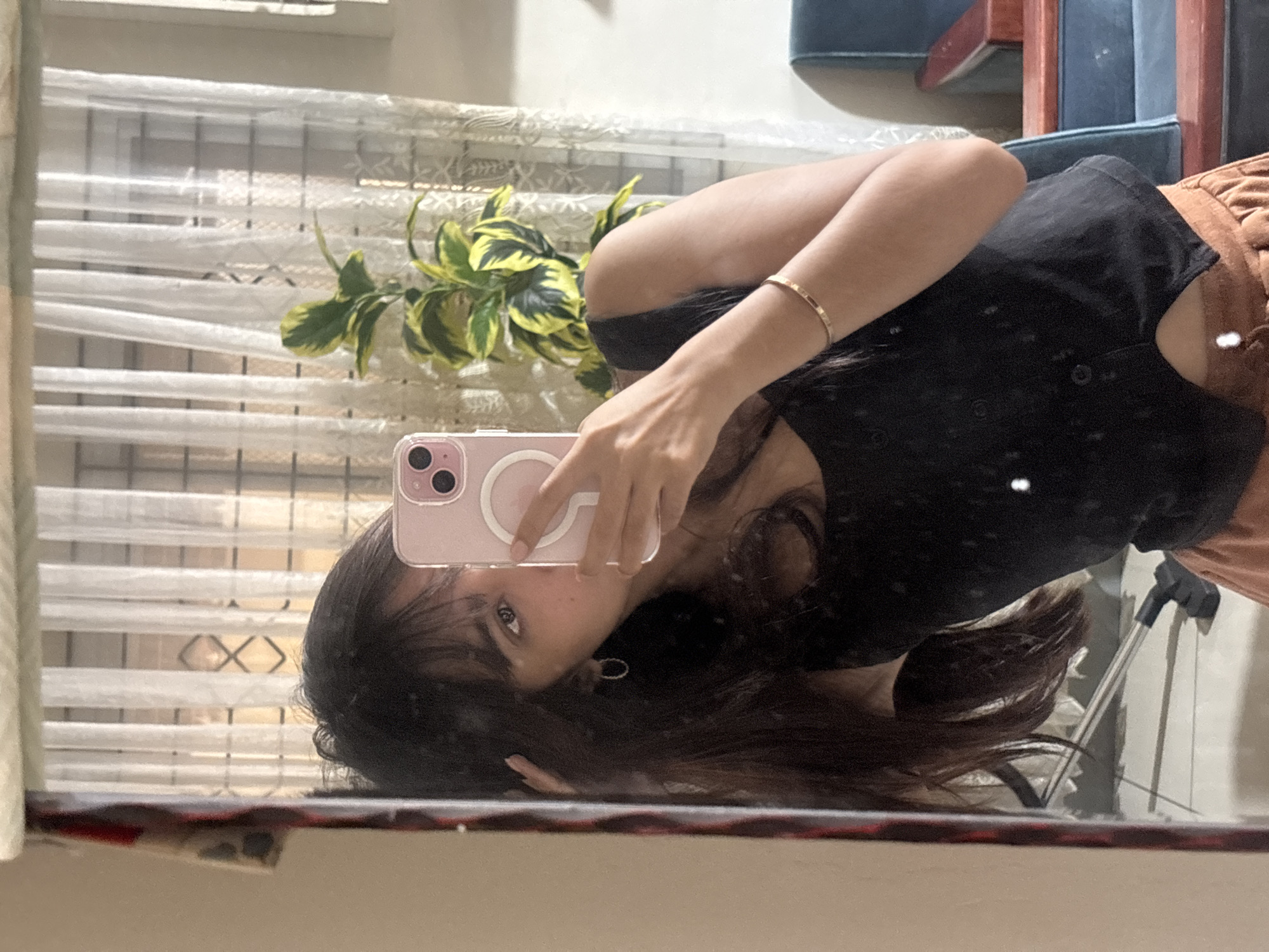 Woman takes mirror selfies at home in Tagum, Philippines