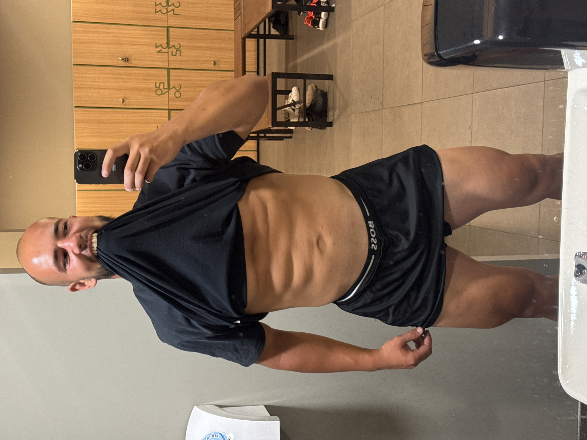 Post-workout mirror selfies in a Sofia gym locker room