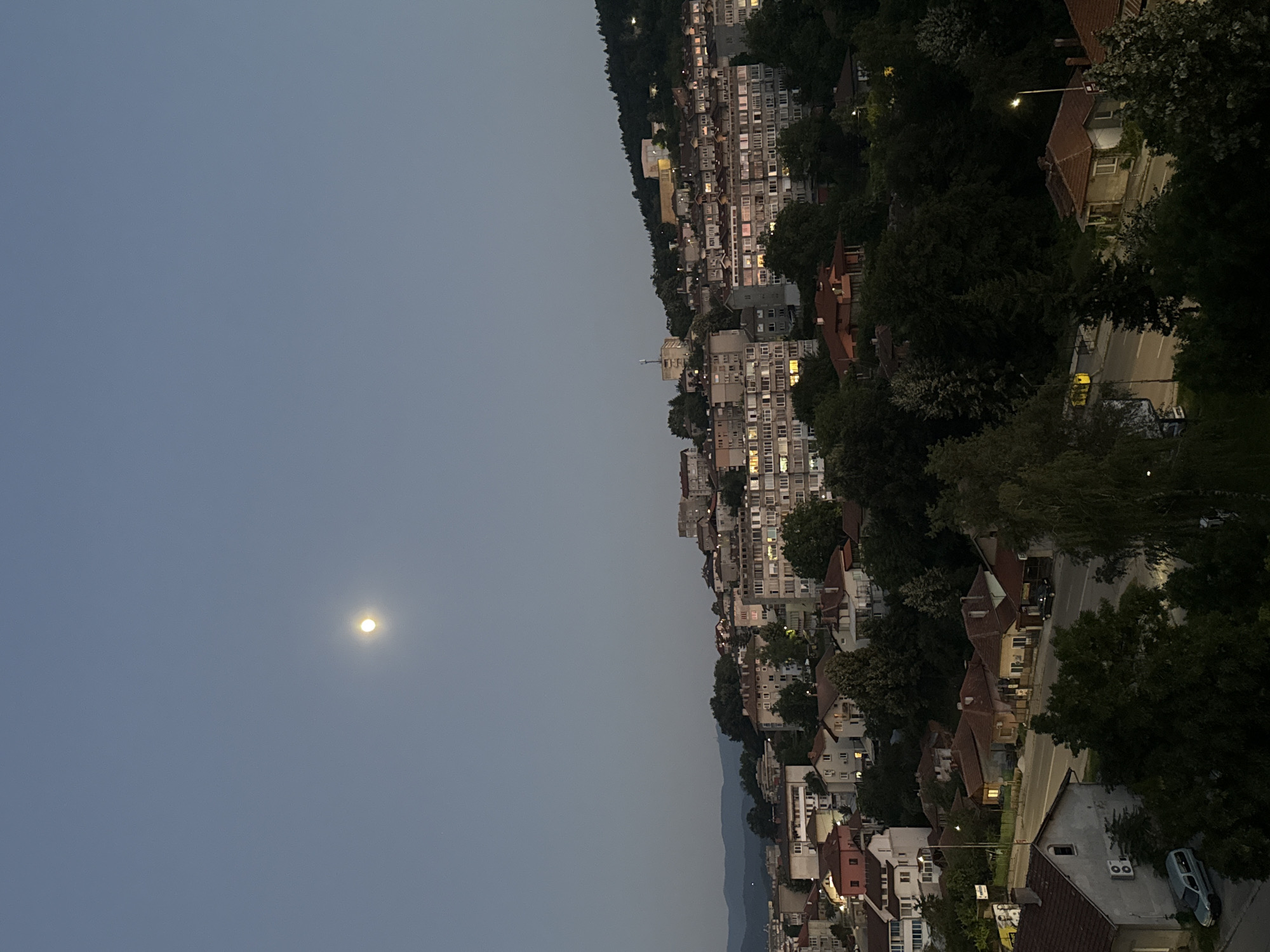 Full moon rises over Gabrovo at dusk