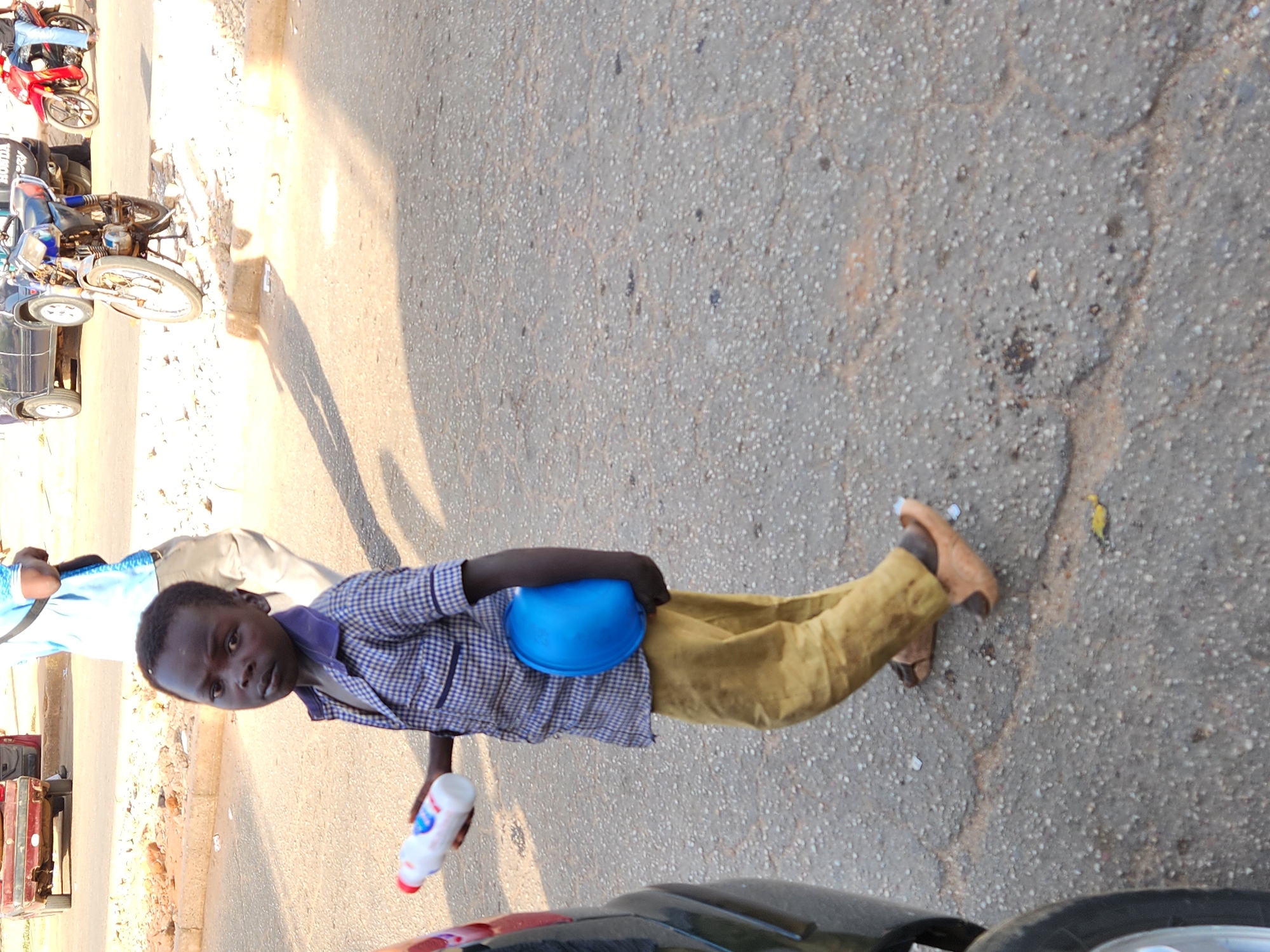 Boy with hard hat spotted on Jos street