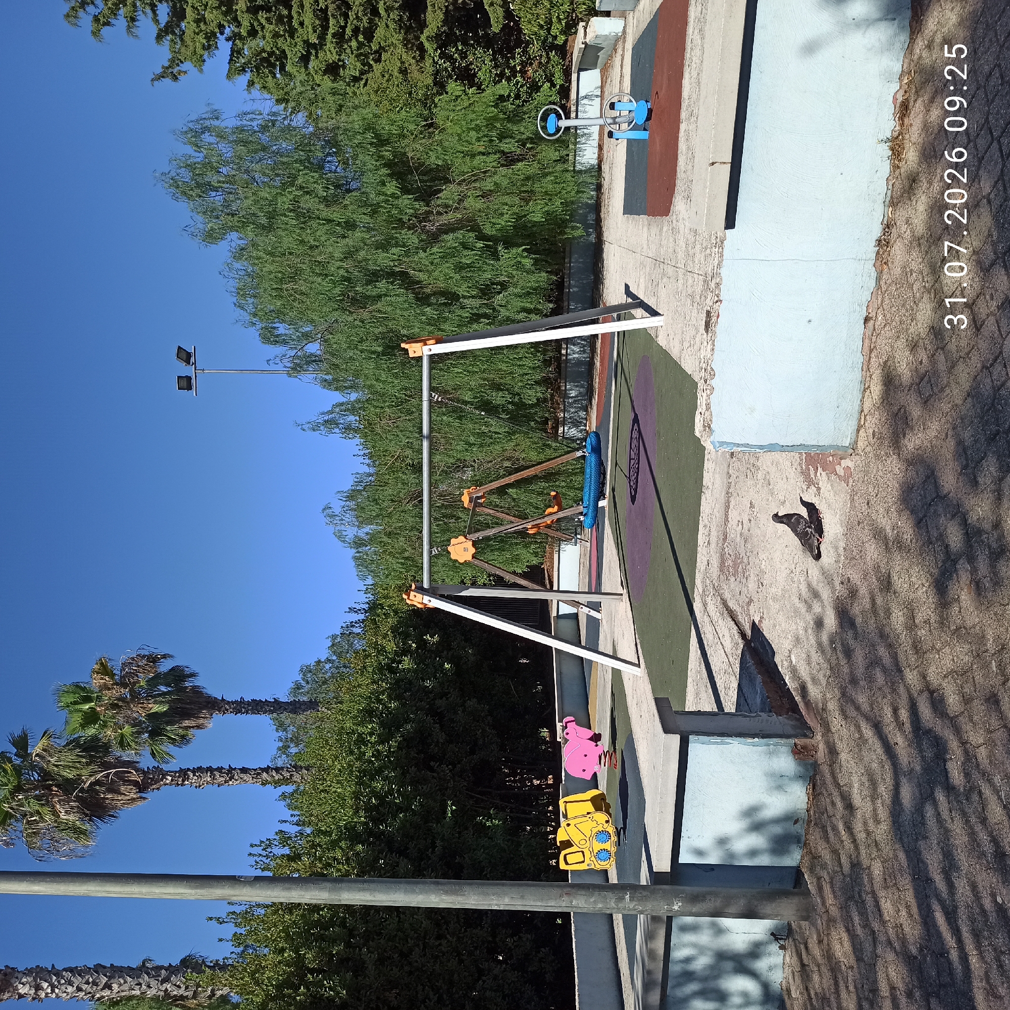 Sunny morning at a Modugno playground and street